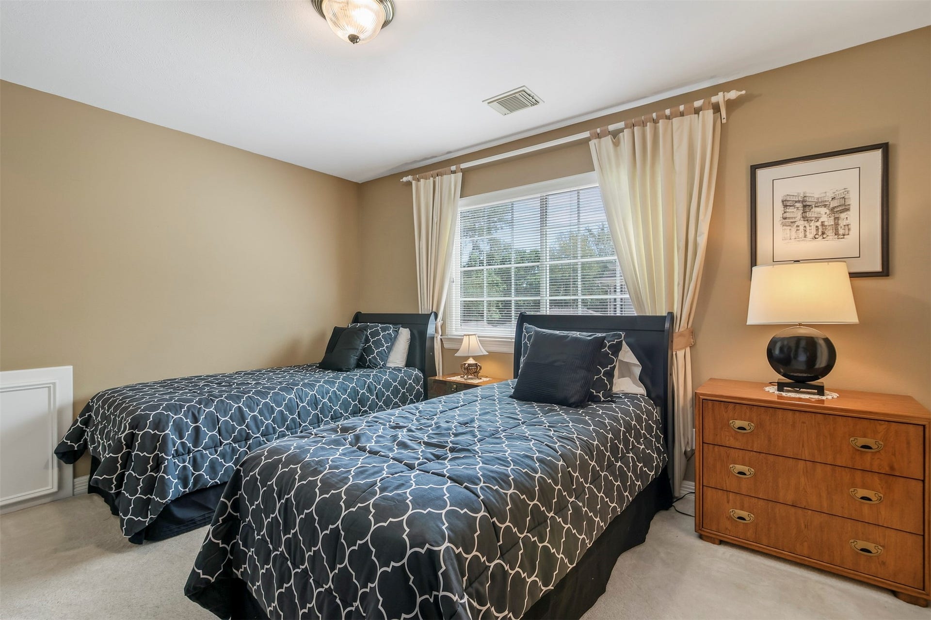 1414 Forest Bend Drive, Sugar Land, TX 77479 Another secondary bedroom with carpet and large picture window as well as access to ensuite shared bathroom.