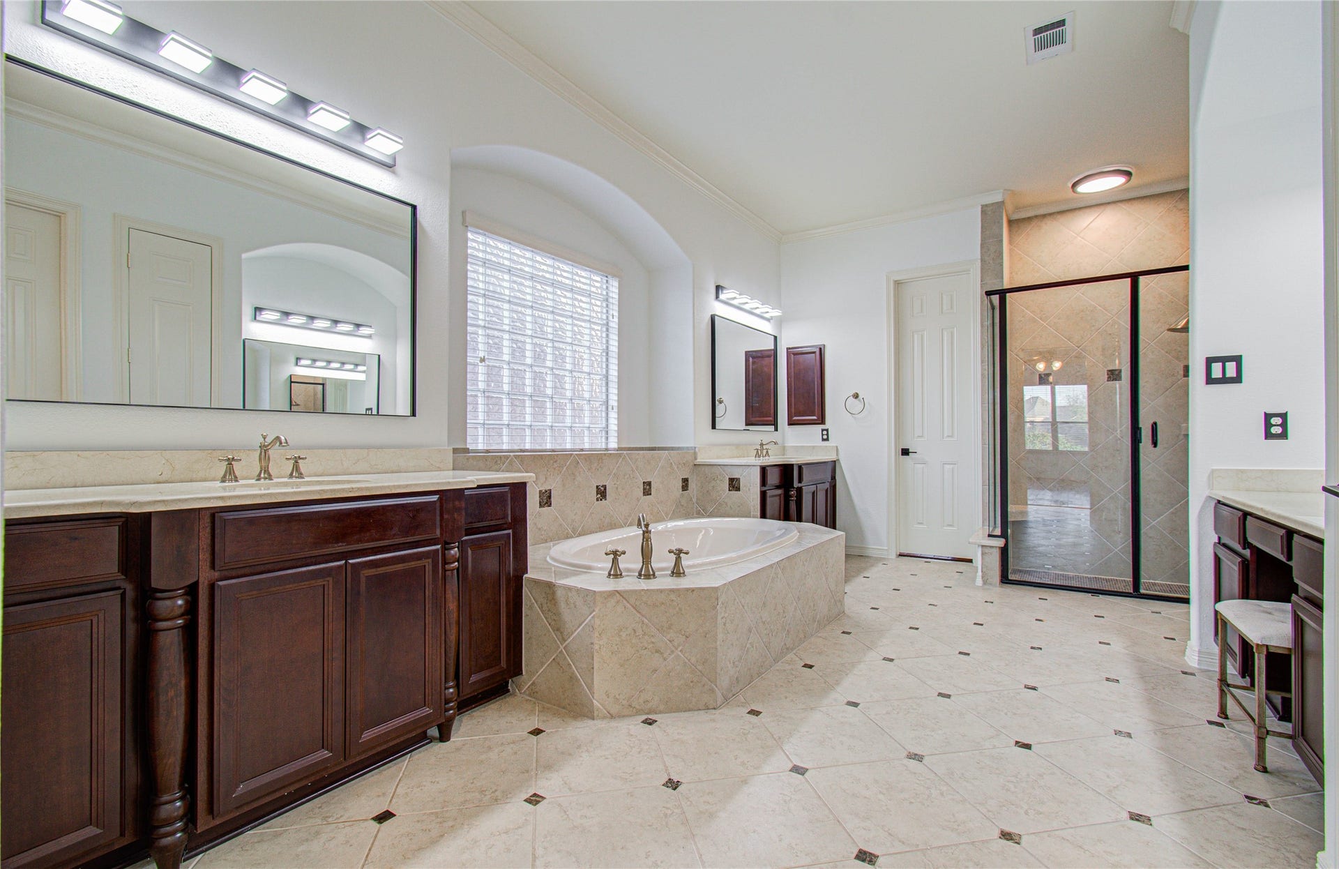 Luxurious primary bathroom featuring dual closets and a state-of-the-art Japanese toilet for ultimate comfort and convenience.