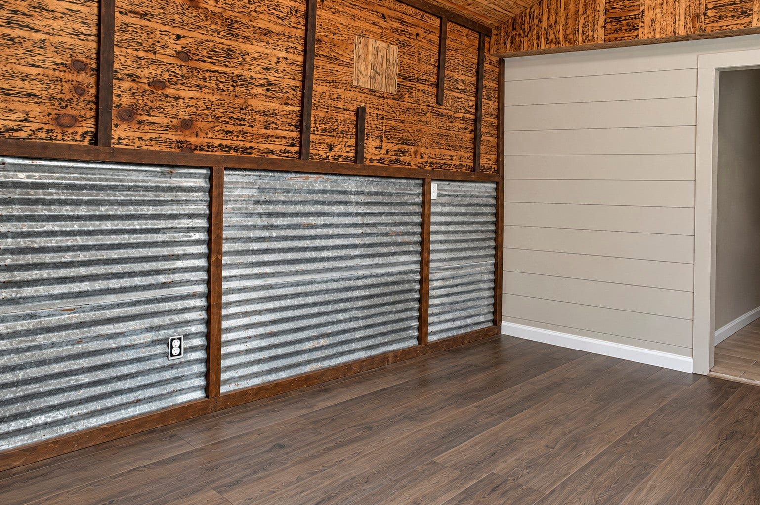 Charming rustic additional kitchen with corrugated metal and wood paneling.