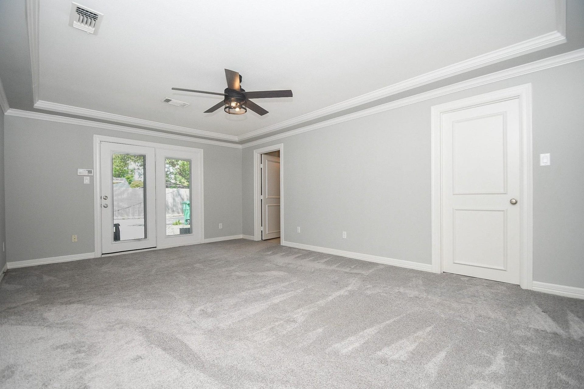5422 Rutherglenn Drive, Houston, TX 77096 Primary bedroom with coffered ceilings, double closets (one is large with custom built ins!)