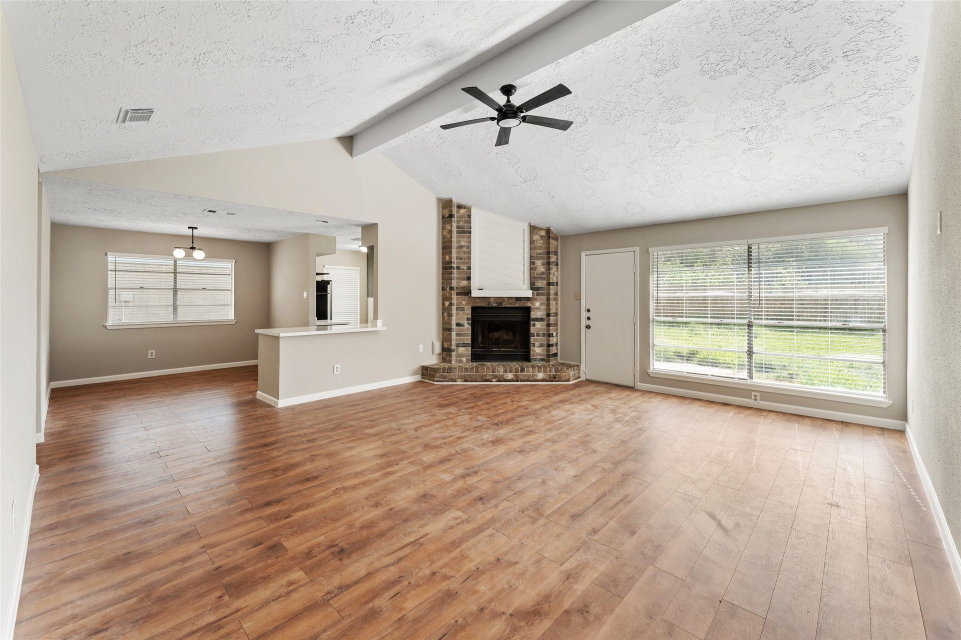 Enjoy the large vaulted family room open to the kitchen and breakfast area.