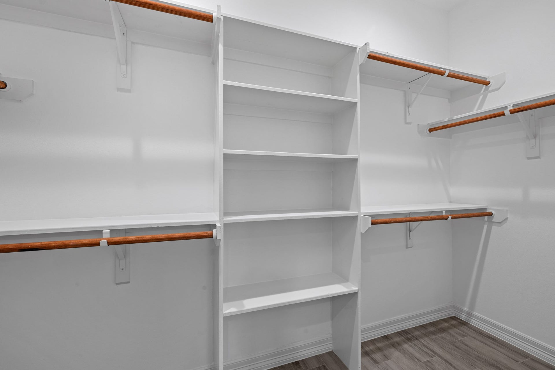 The custom closet offers PLENTY of space to hang your suits and/or dresses, easily access your shoes, and top shelving for those items that you only bring out for the special occasions.