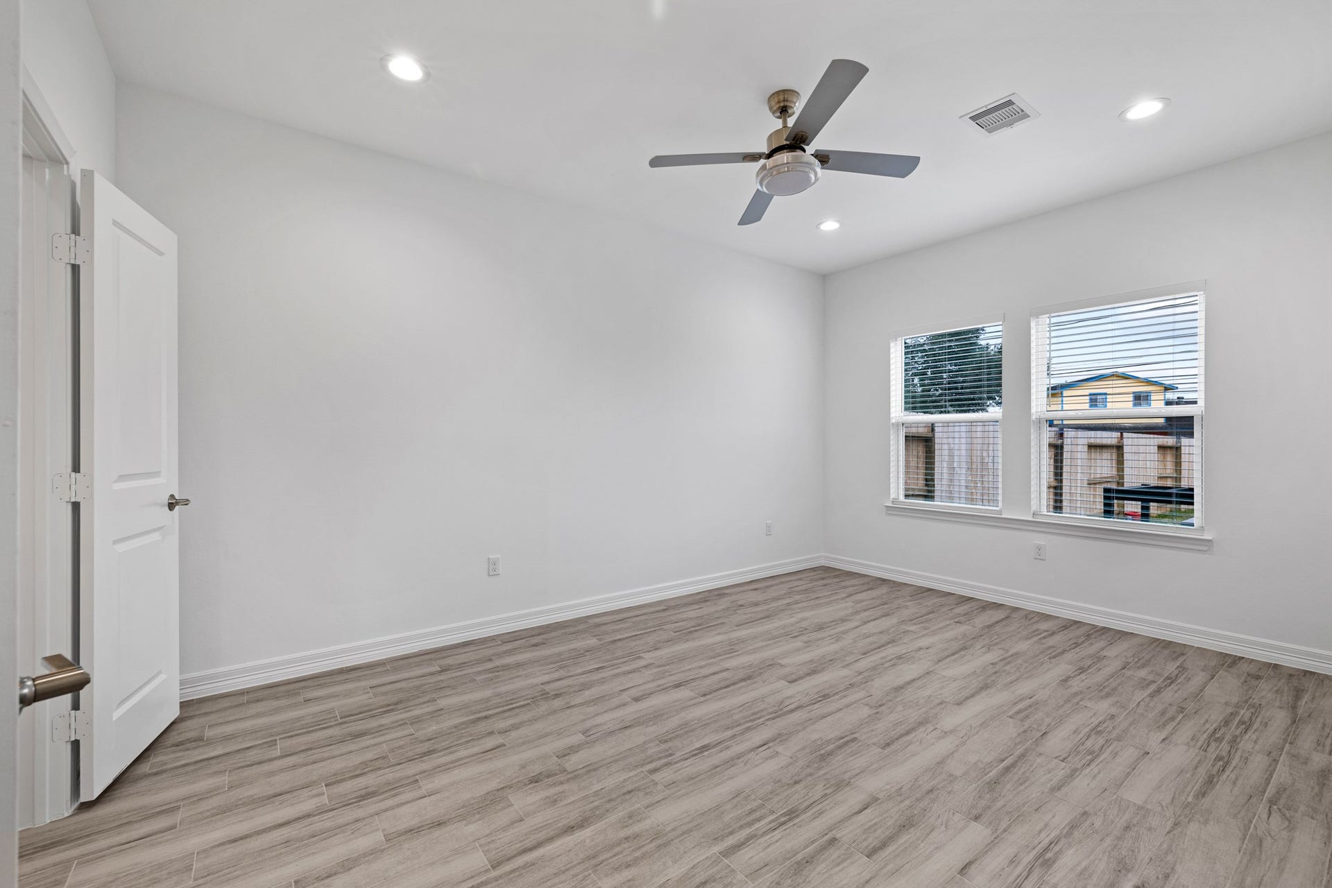 The oversized Primary Bedroom is at the rear of the home with complete privacy, as the other 2 bedrooms are both on the opposite side of the hallway.