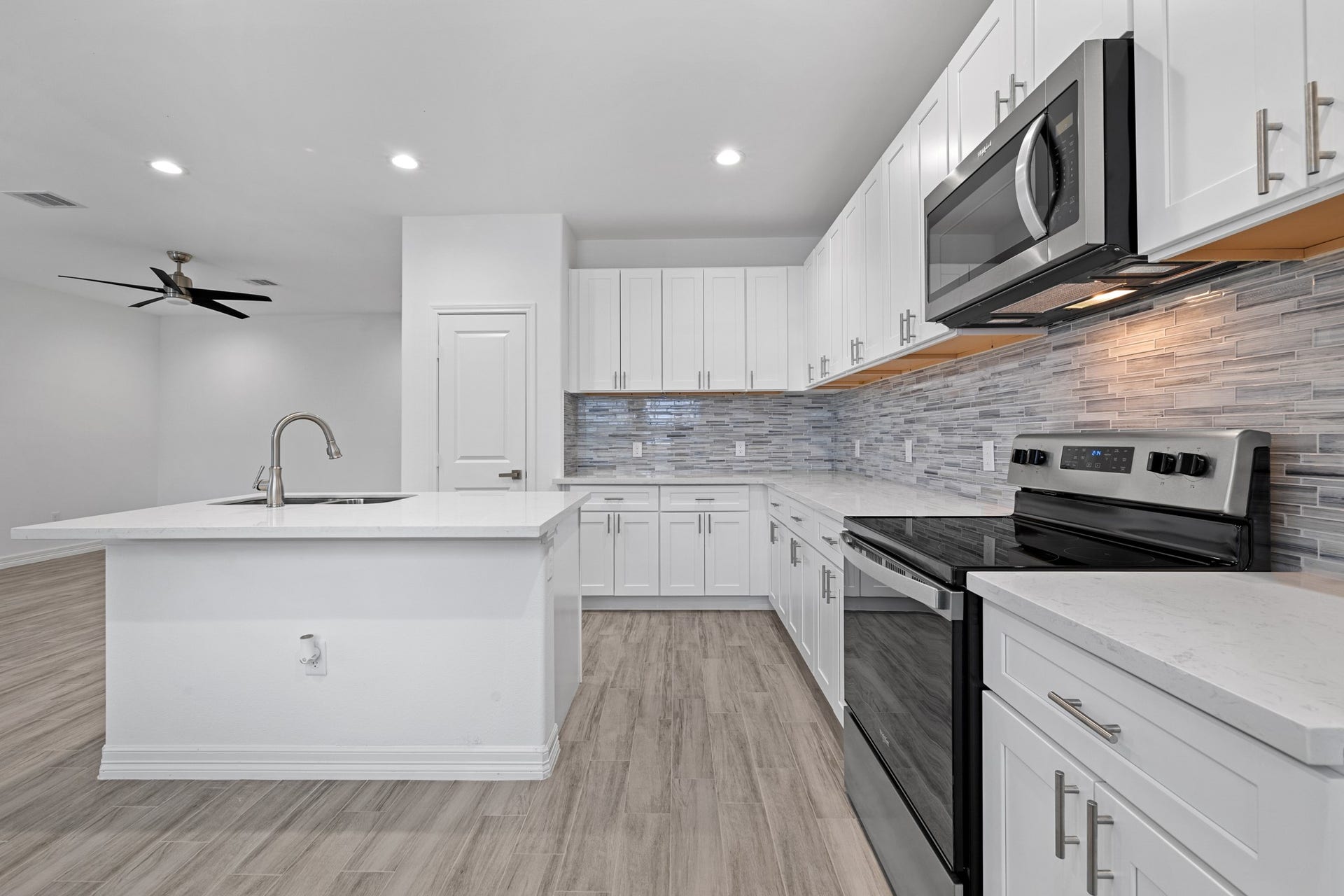 Another angle of the kitchen highlighting the space.