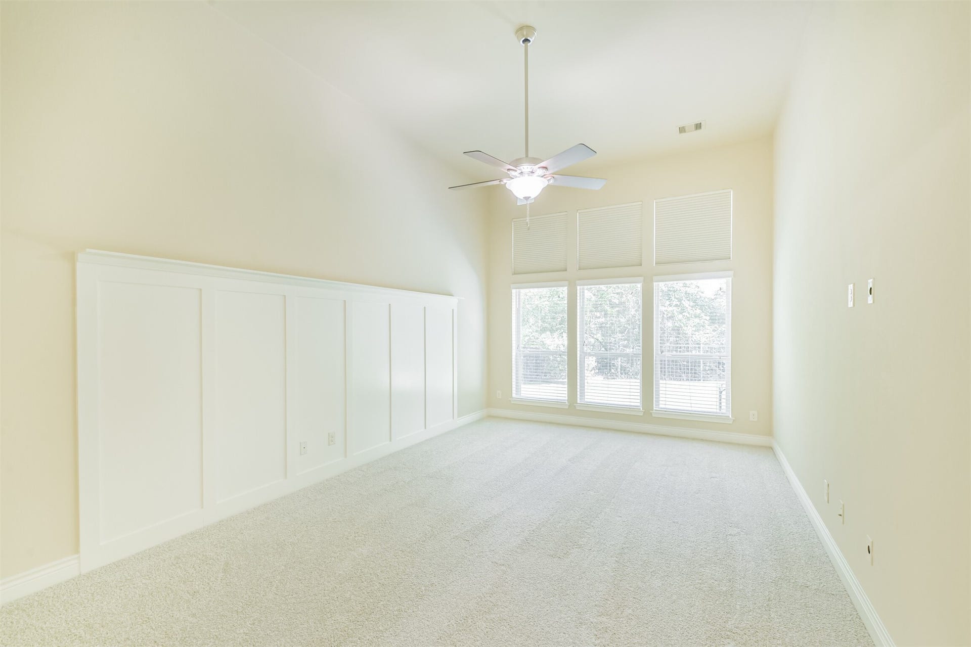 1735 Wickham Reach Drive, Spring, TX 77386 Spacious primary bedroom with large windows bringing in natural light.