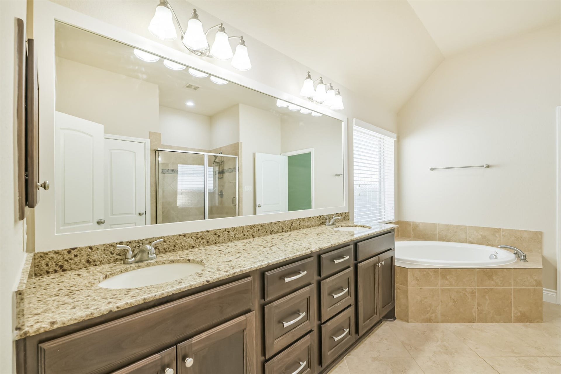 1735 Wickham Reach Drive, Spring, TX 77386 Another view of the primary bathroom showcasing the dual vanity and soaking tub.