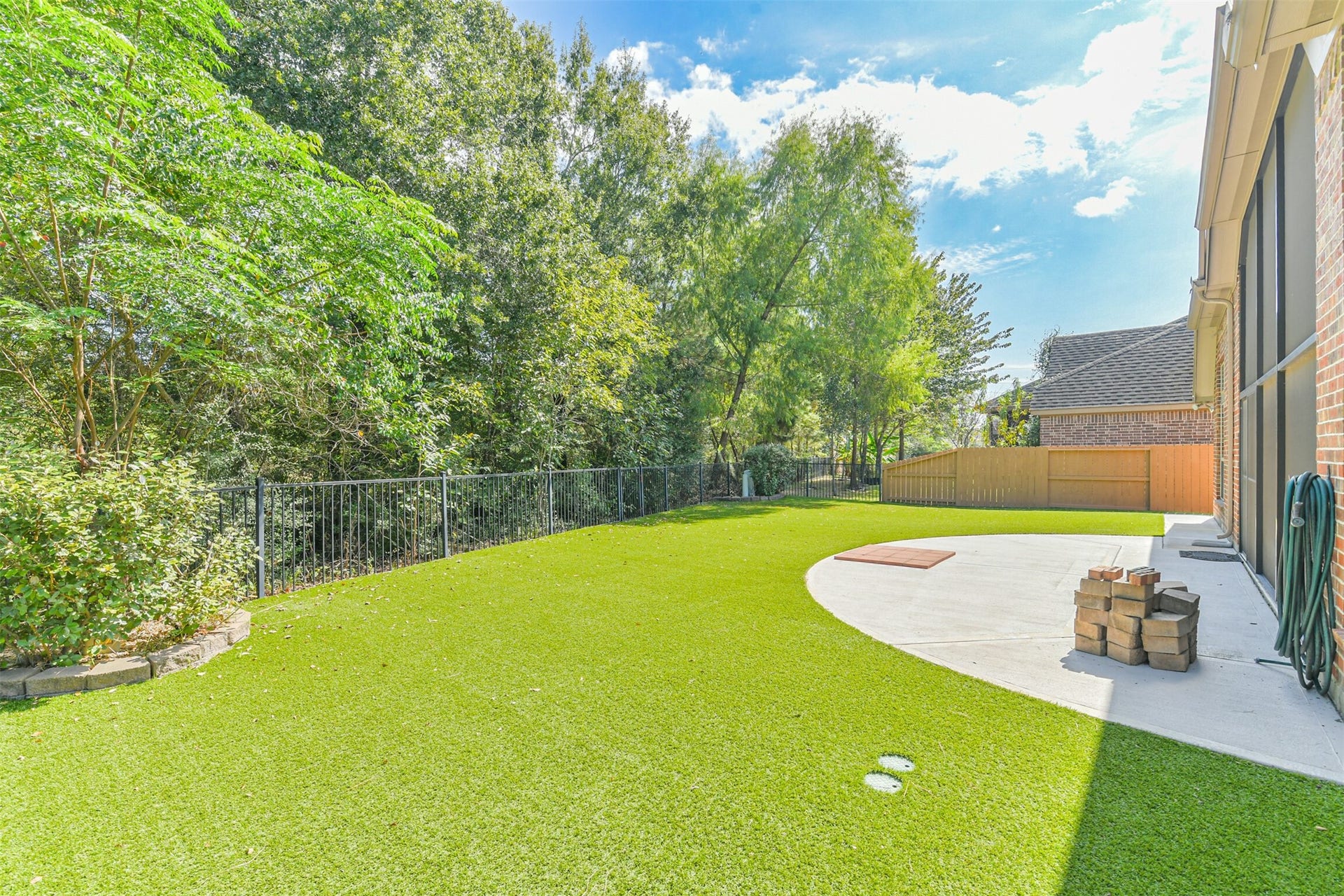 1735 Wickham Reach Drive, Spring, TX 77386 Spacious backyard with plenty of open green space and mature trees.
