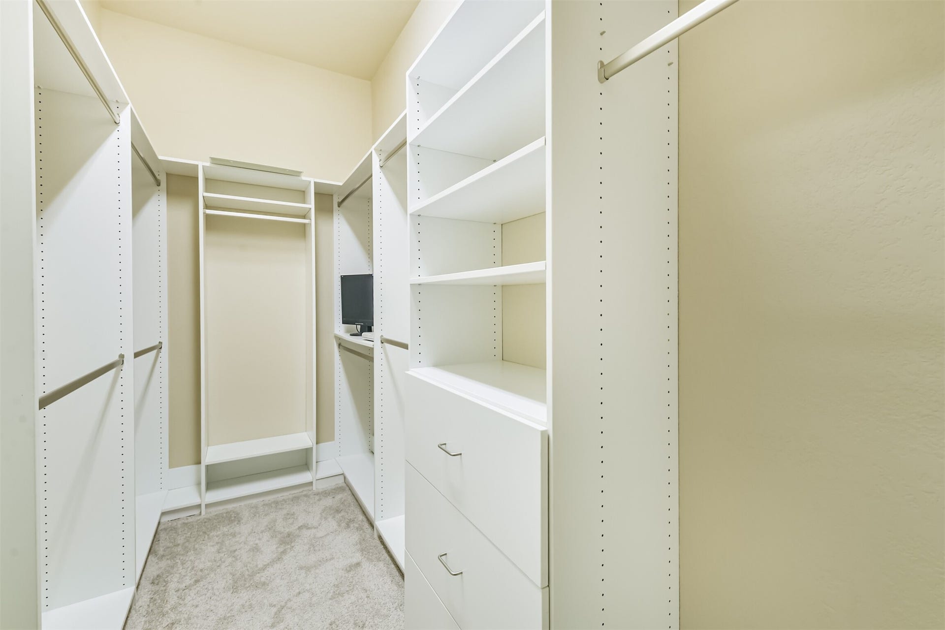 1735 Wickham Reach Drive, Spring, TX 77386 Walk-in closet with built-in shelving and plenty of storage.