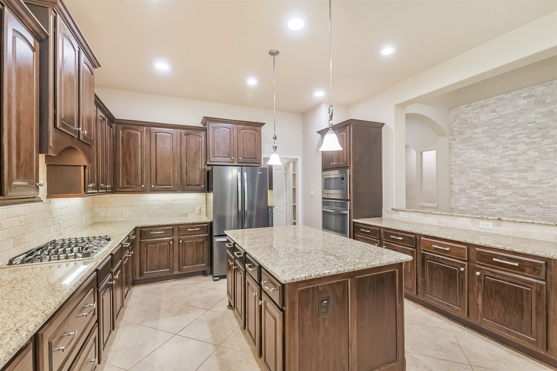 1735 Wickham Reach Drive, Spring, TX 77386 Spacious kitchen with abundant cabinetry, generous counter space, and a center island.