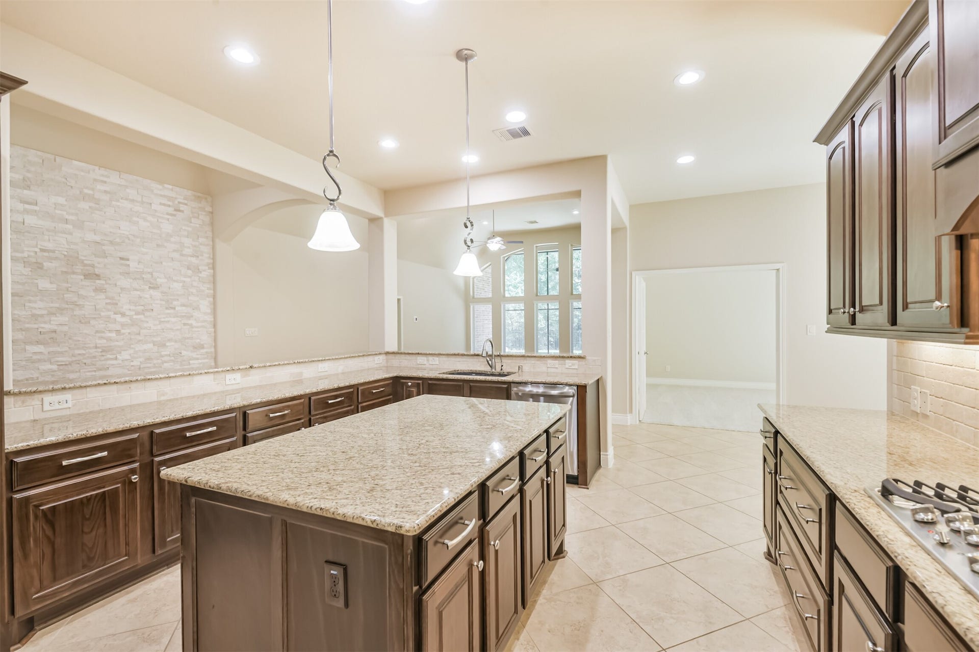 1735 Wickham Reach Drive, Spring, TX 77386 Spacious kitchen with plenty of cabinetry and an open connection to the surrounding living areas.