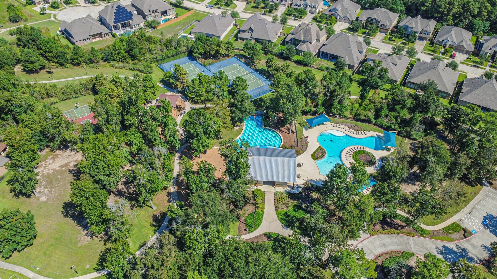 1735 Wickham Reach Drive, Spring, TX 77386 Aerial view of the community pool and surrounding neighborhood amenities.
