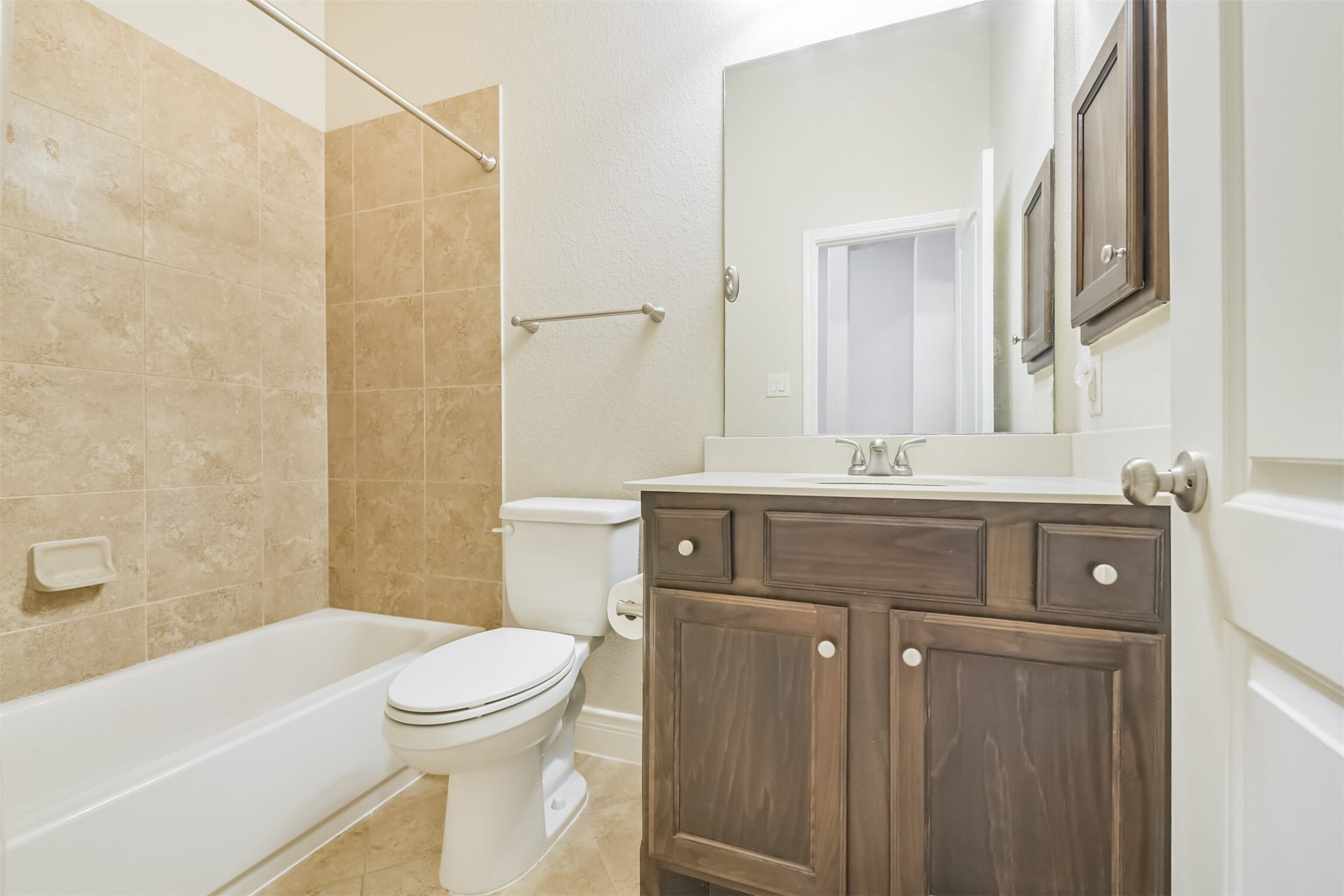 1735 Wickham Reach Drive, Spring, TX 77386 Full bathroom with a tub and shower combination and generous vanity.