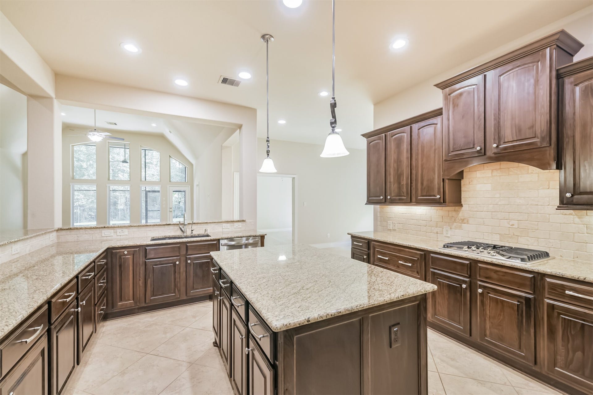1735 Wickham Reach Drive, Spring, TX 77386 Another view of the kitchen highlighting the center island and generous workspace.