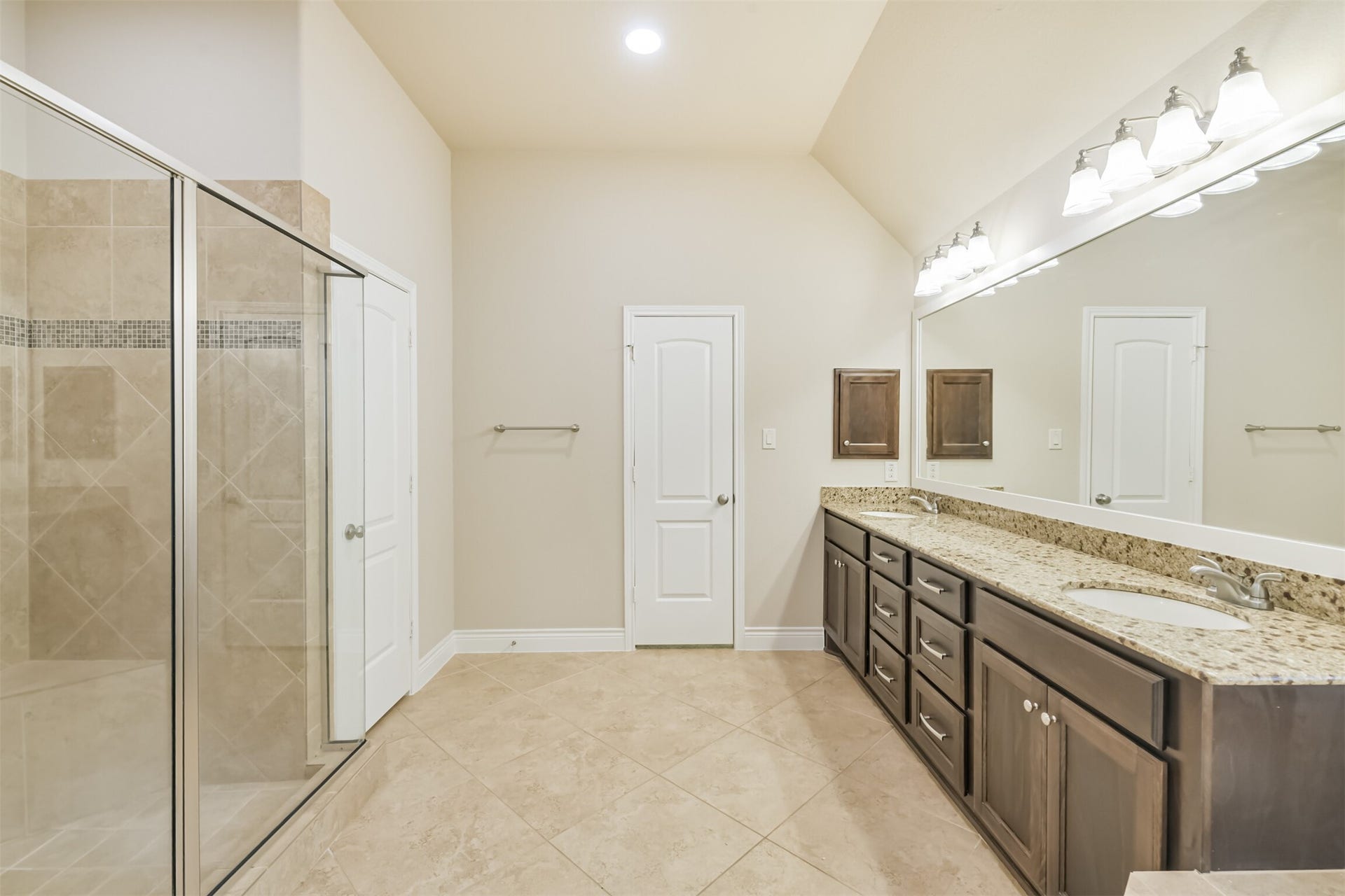1735 Wickham Reach Drive, Spring, TX 77386 Primary bathroom with an extended vanity and separate shower.