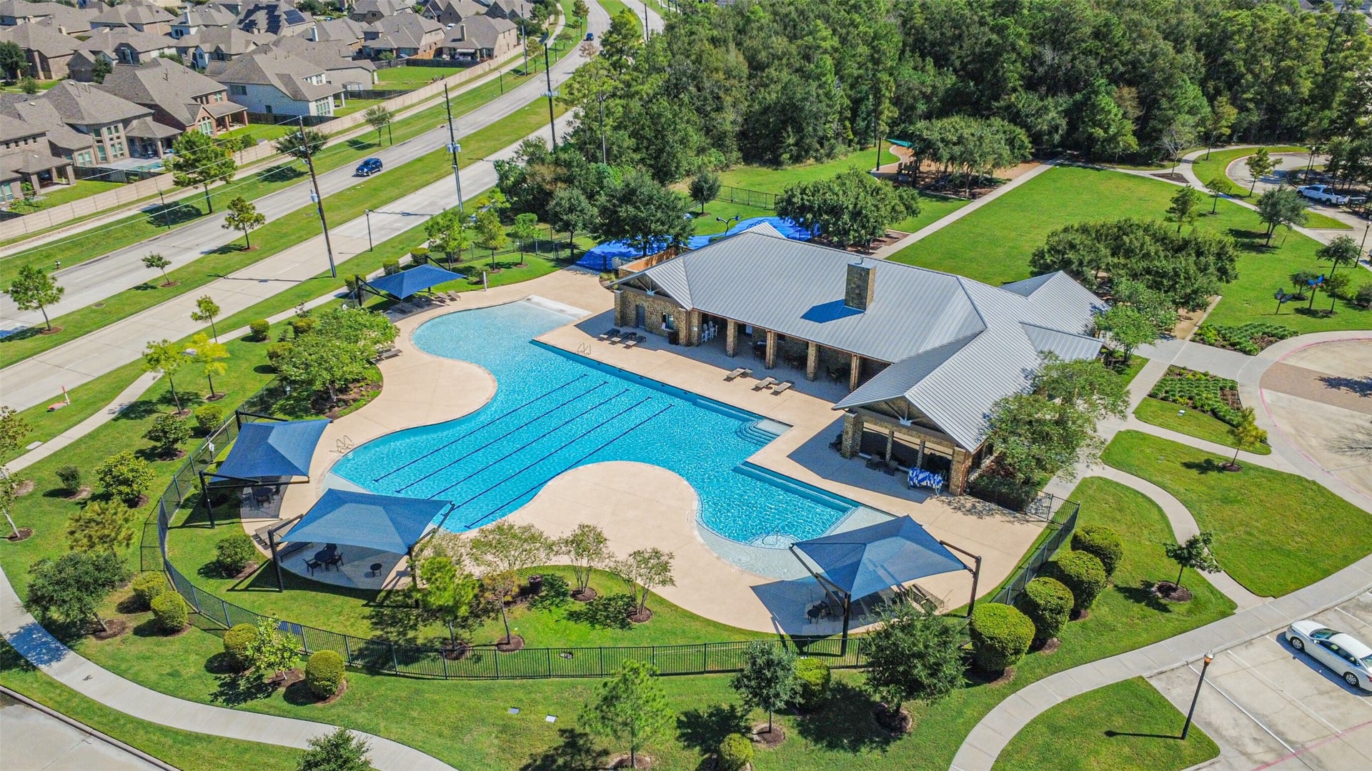 1735 Wickham Reach Drive, Spring, TX 77386 Nearby community amenities featuring a resort-style pool and recreation area.