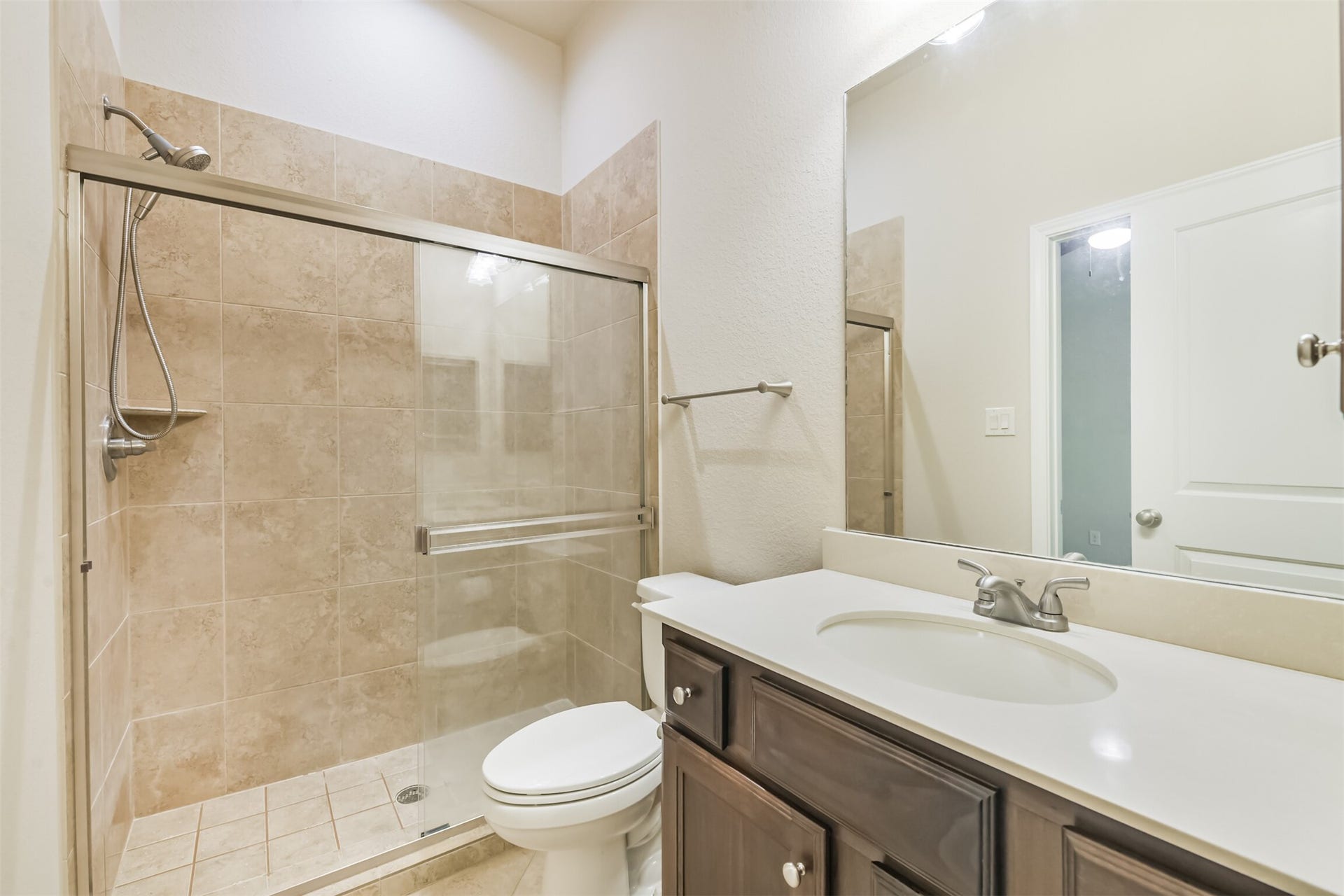 1735 Wickham Reach Drive, Spring, TX 77386 Full bathroom with a spacious vanity and enclosed shower.