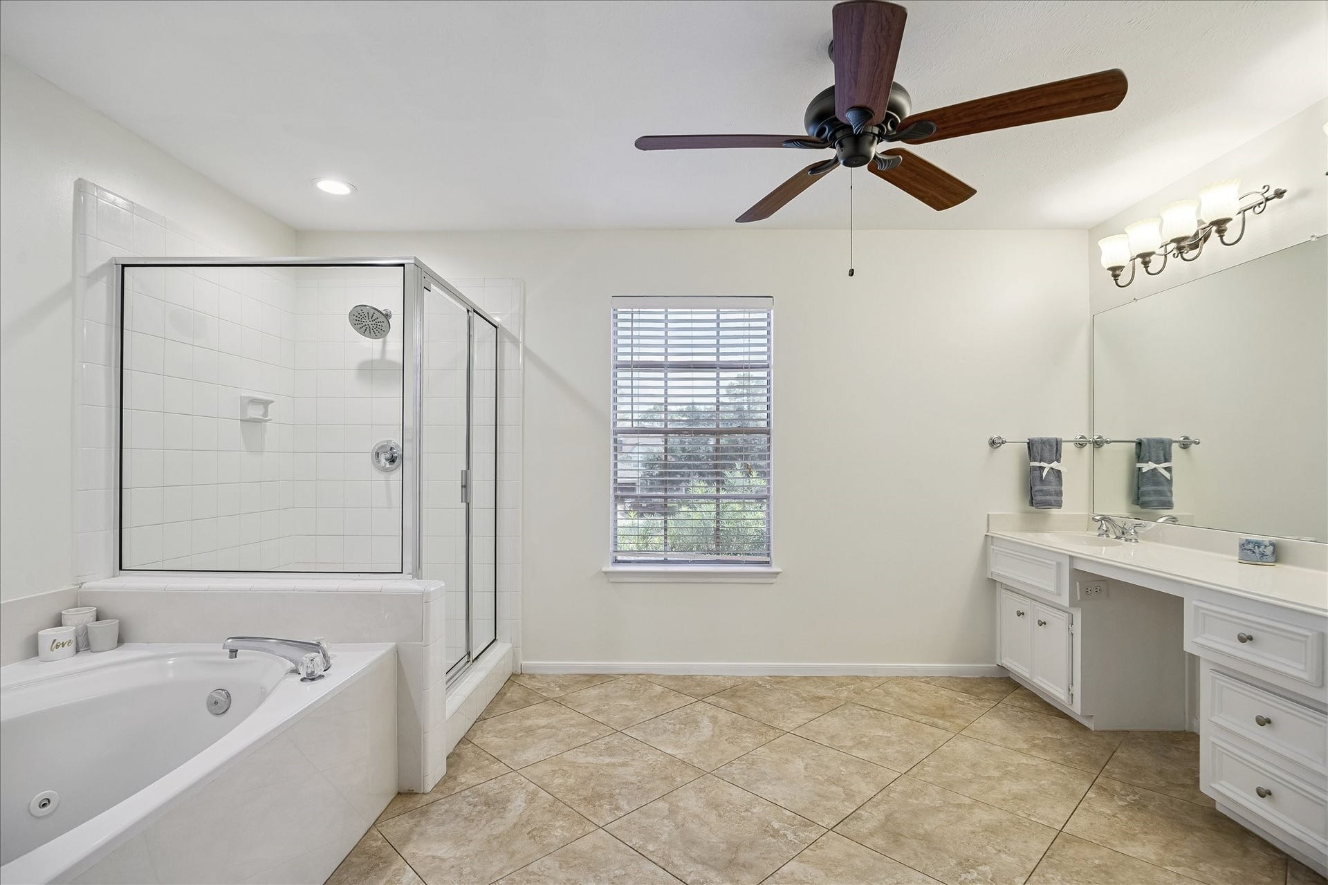 1306 Forest Hollow Drive, Missouri City, TX 77459 The en-suite also offers a separate shower and soaking bath.