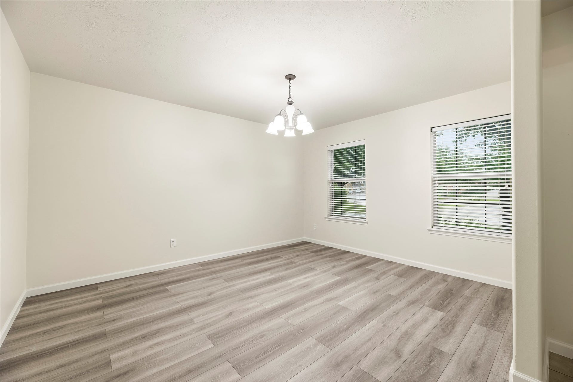 14223 Pinefrost Lane, Cypress, TX 77429 Formal dining room off the front entry with beautiful LVP flooring.