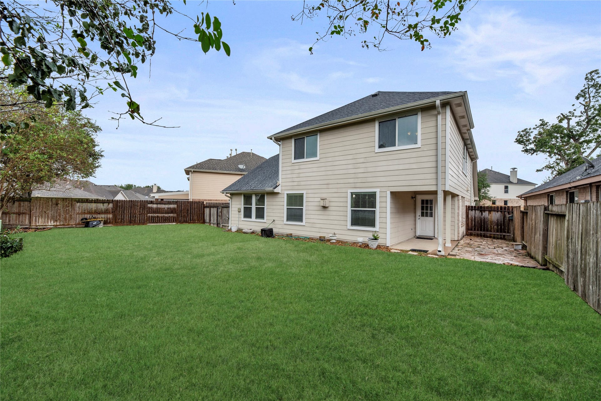14223 Pinefrost Lane, Cypress, TX 77429 Private backyard with a covered patio.