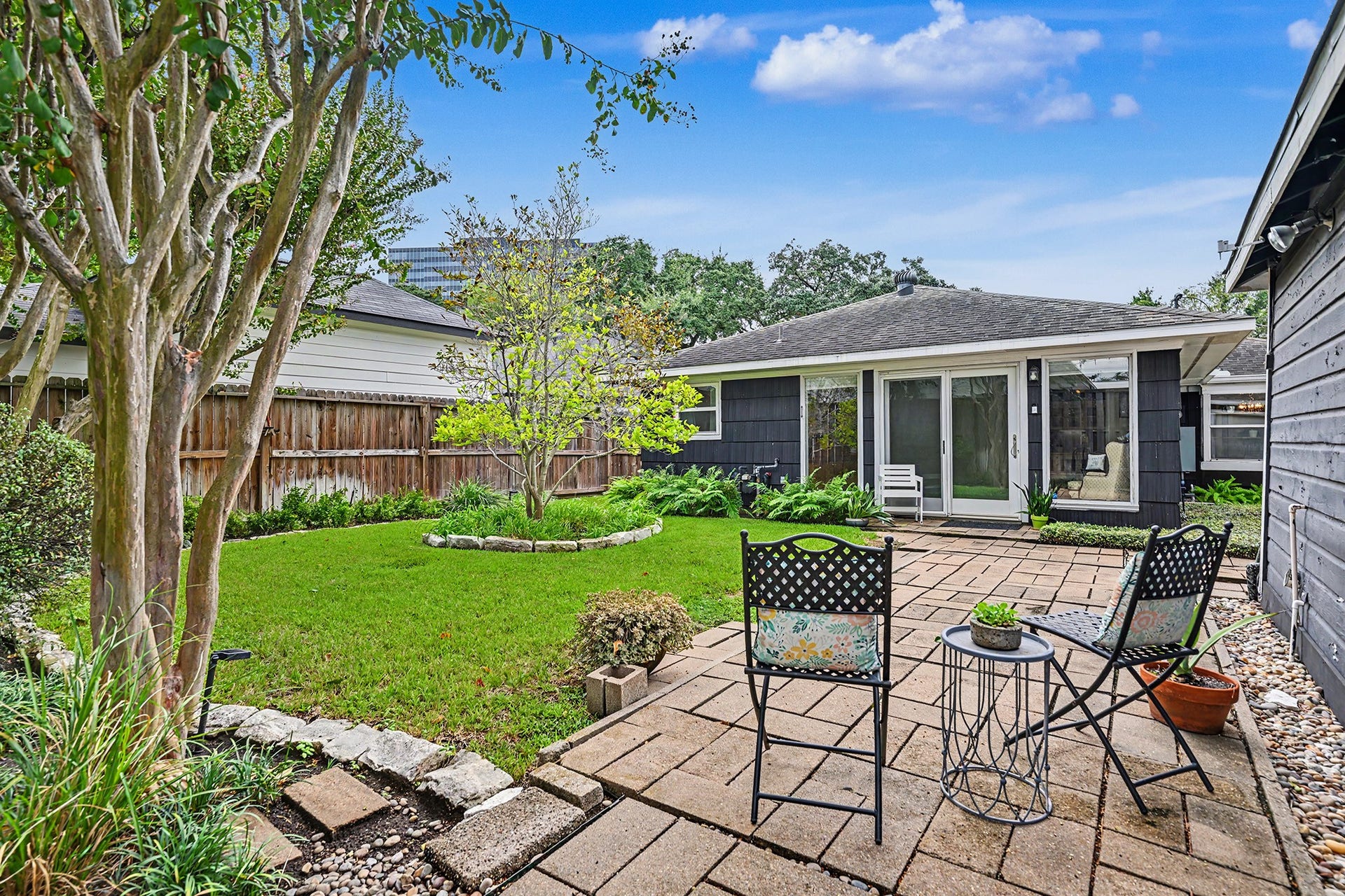 4102 Portsmouth Avenue, Houston, TX 77027 Beautiful backyard setting with greenspace, mature landscaping and patio area.