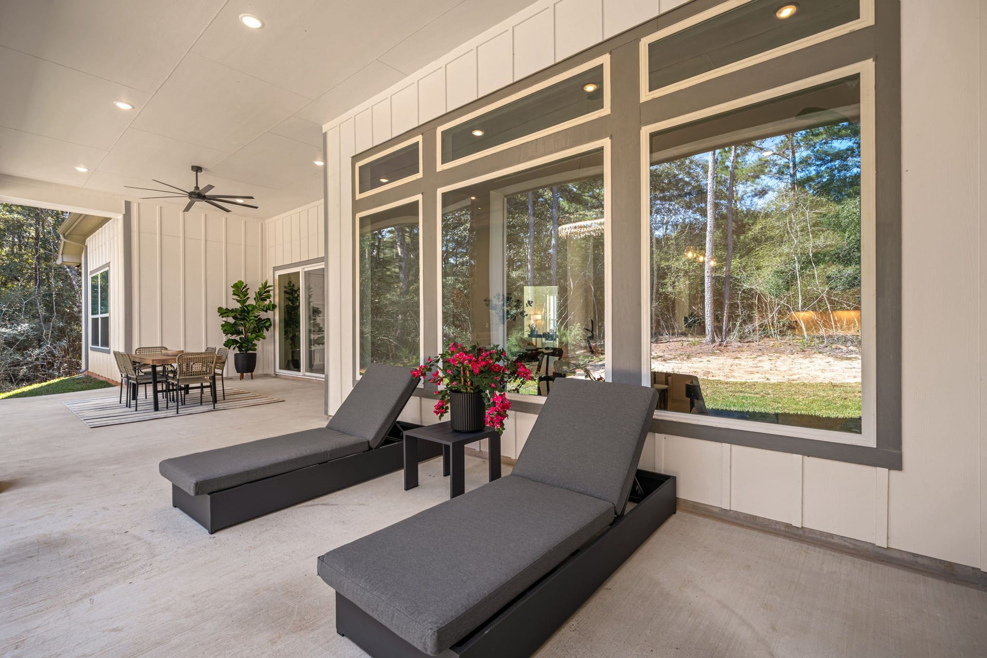 Expansive covered outdoor living area with ample room for lounging and entertaining.