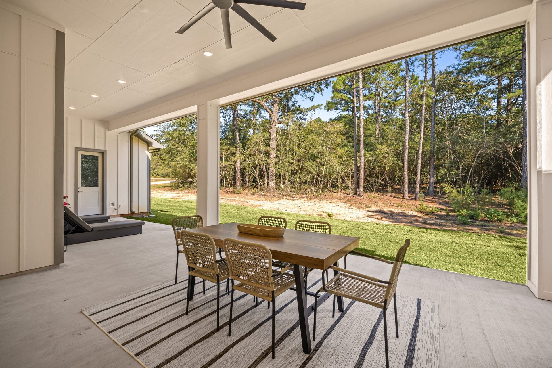 Expansive outdoor living area offering a seamless connection between indoor comfort and backyard entertaining.