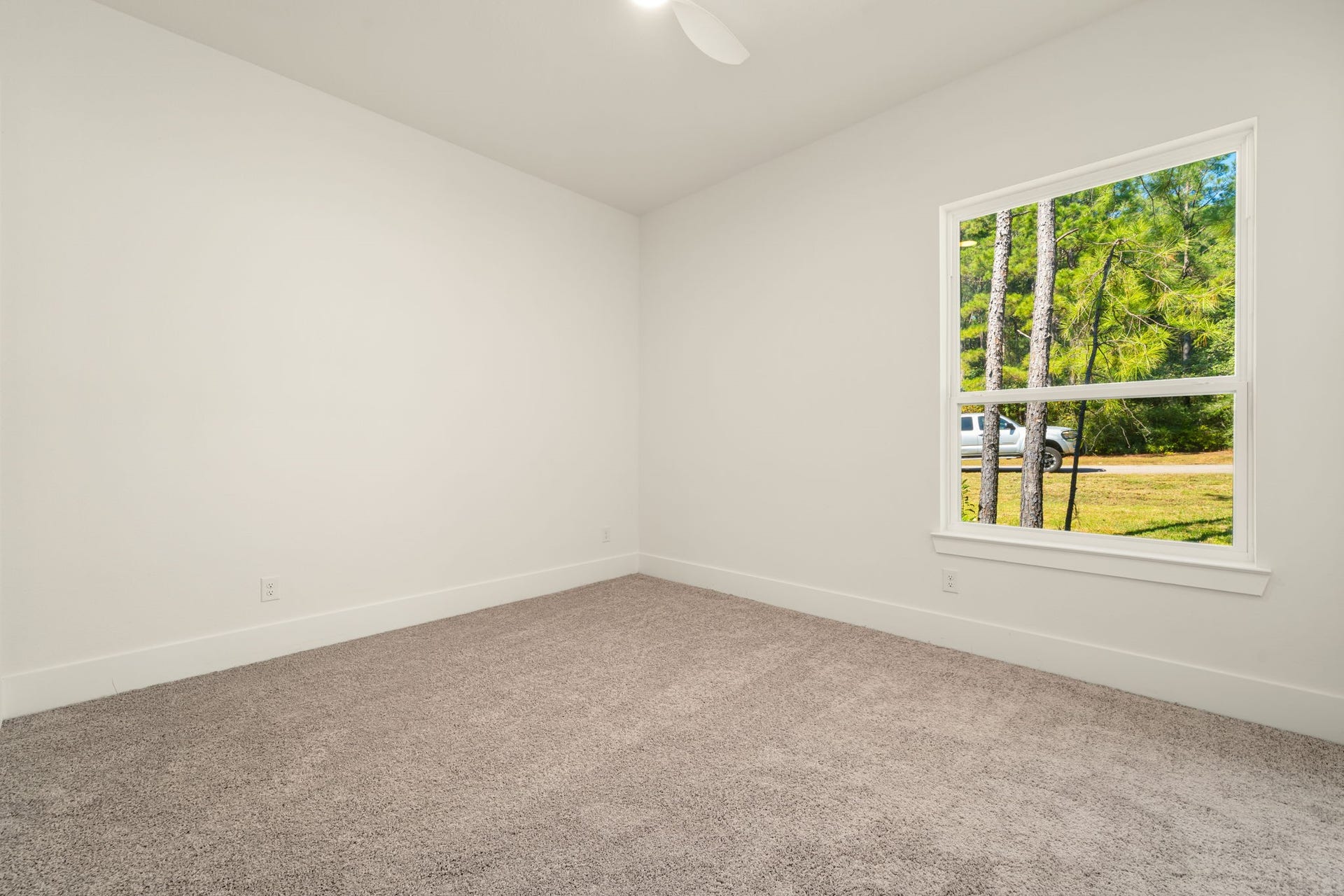 Generously sized secondary bedroom offering a versatile layout and abundant natural light.