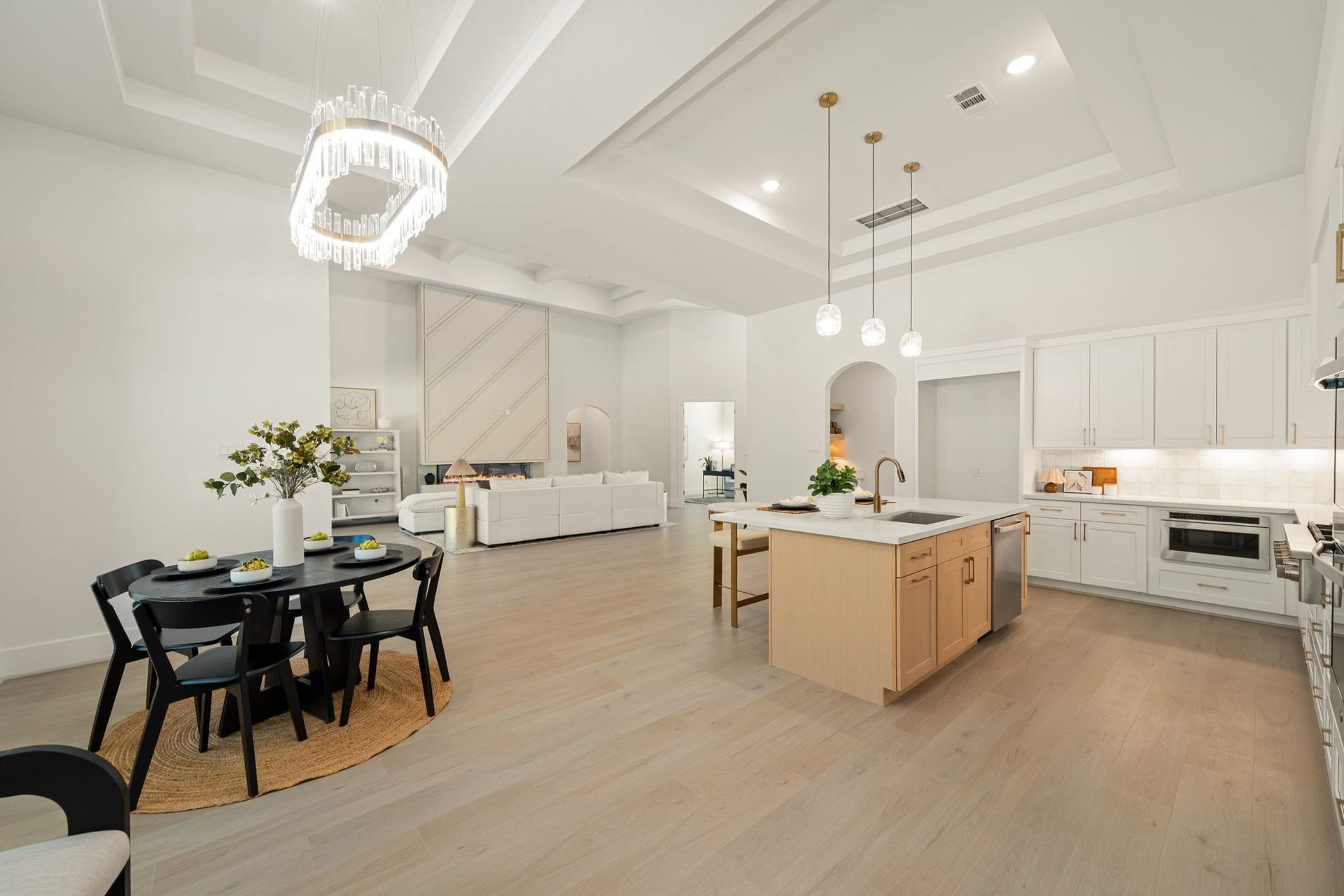 Expansive kitchen with an oversized center island and seamless flow into the adjoining breakfast area.