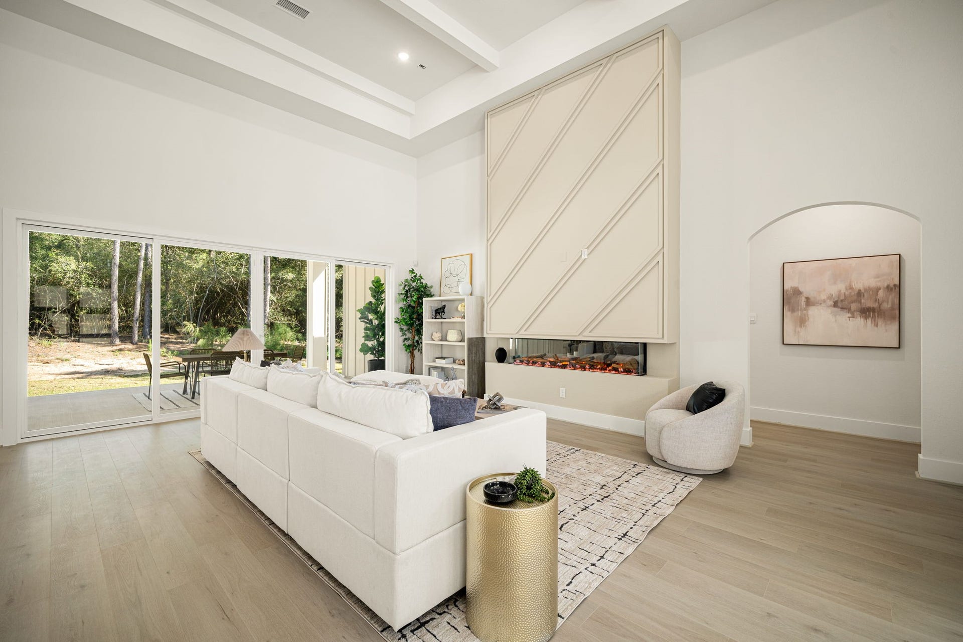 Elegant living space with designer finishes, custom architectural details, and serene backyard views.