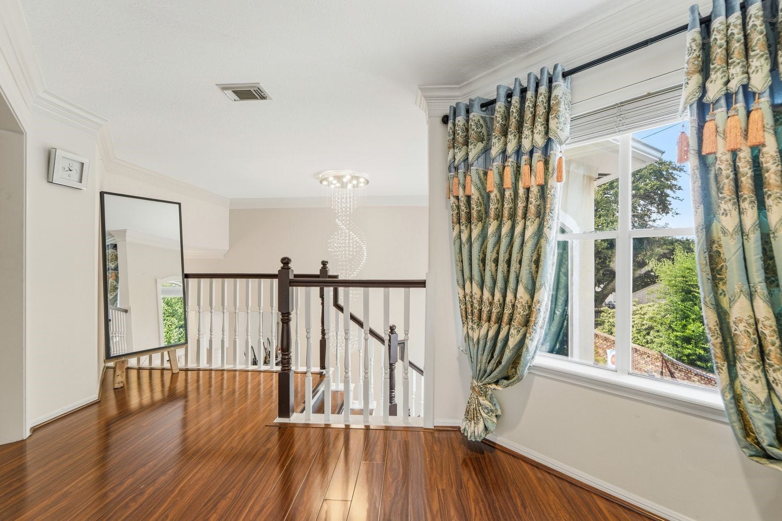 1606 Clearwater Creek Drive, Sugar Land, TX 77478 At the top of the stunning staircase is a small landing.