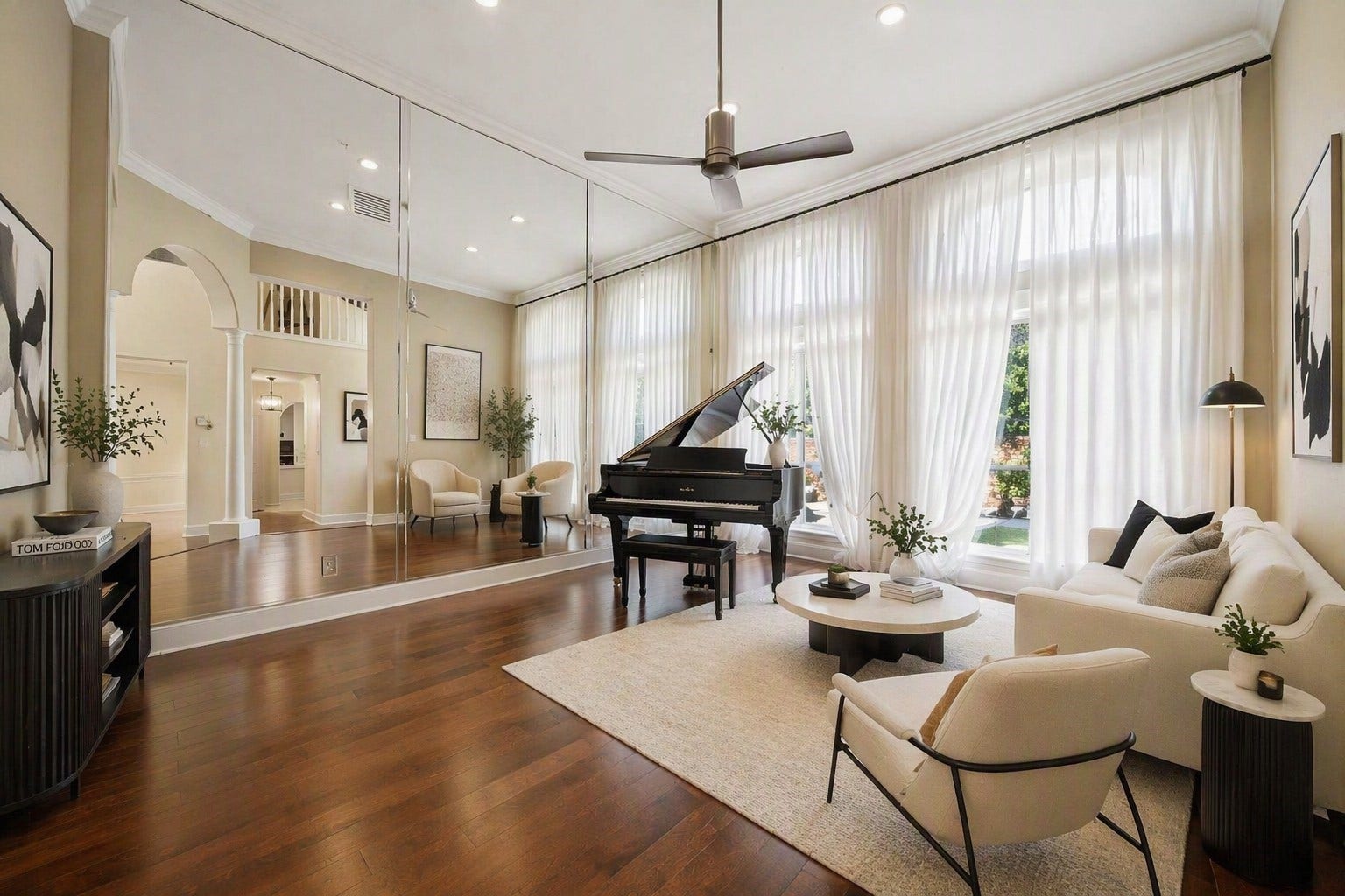 1606 Clearwater Creek Drive, Sugar Land, TX 77478 The formal living room with high ceilings and a wall of windows. Virtually staged.