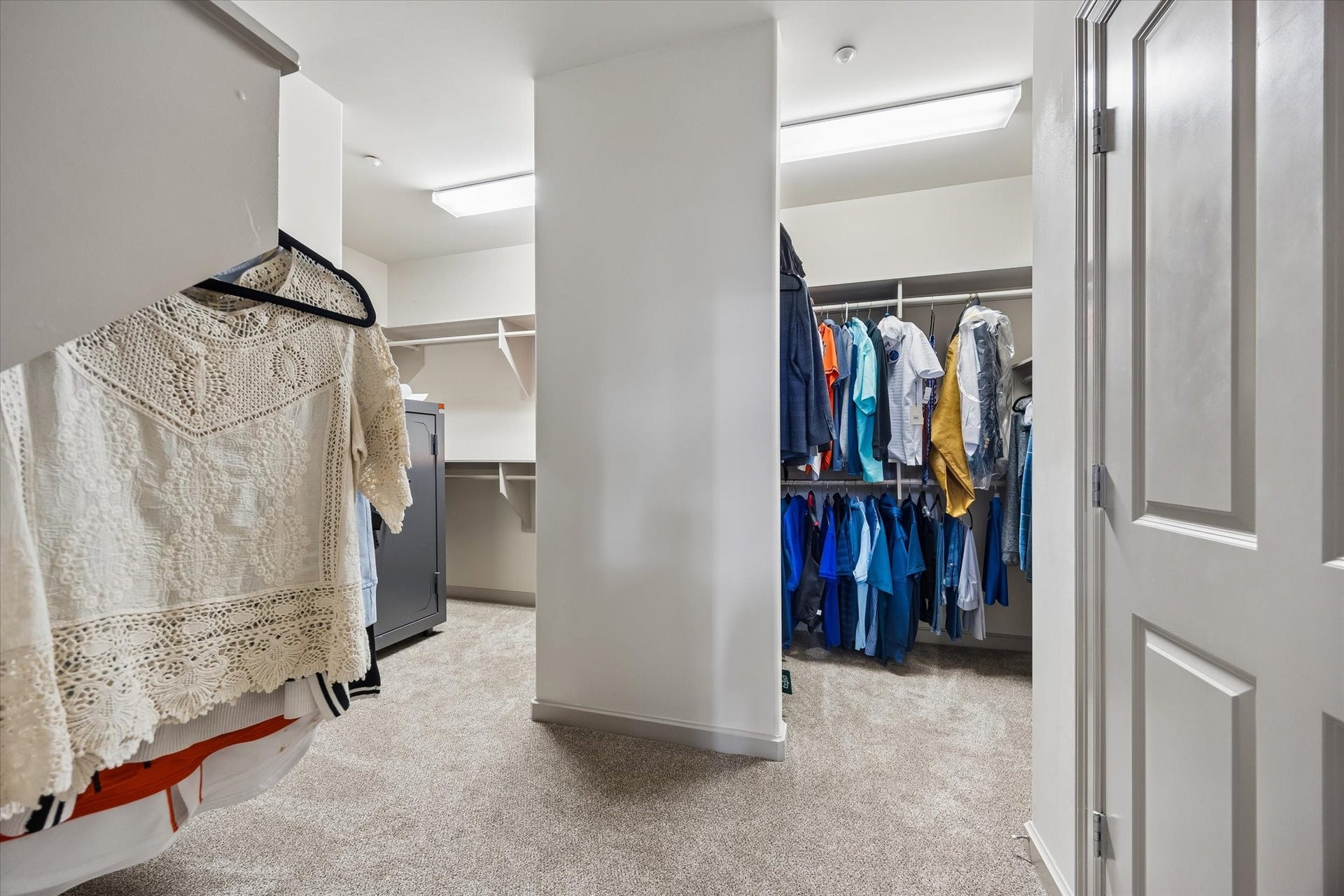 914 Main Street, #801, Houston, TX 77002 Spacious walk-in primary closet featuring ample hanging space and shelving, perfect for organized storage.