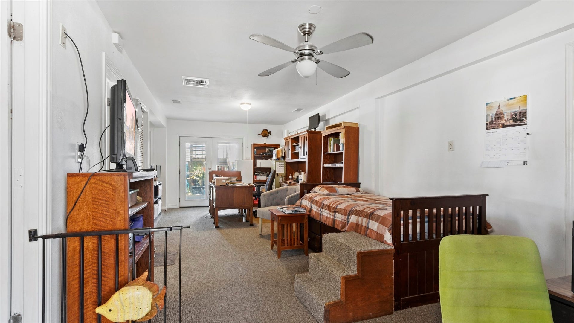 1097 Redfish Street, Bayou Vista, TX 77563 Downstairs boasts a large flexible ground-level suite complete with its own private bath and private entranceideal as a 3rd bedroom, guest quarters, or home office.