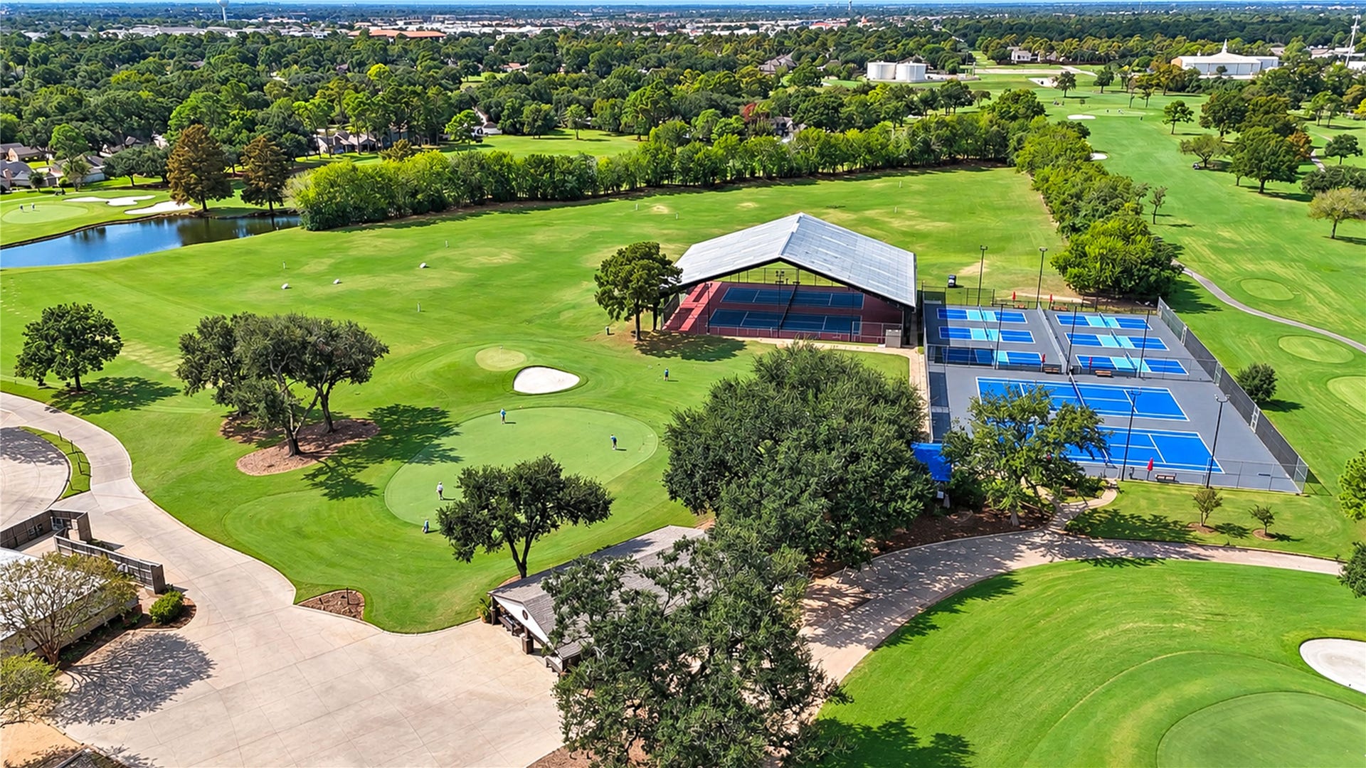 6839 Hertford Park Drive, Houston, TX 77084 An aerial view of Hearthstone Country Clubs golf and racquet facilities. Separate membership required.