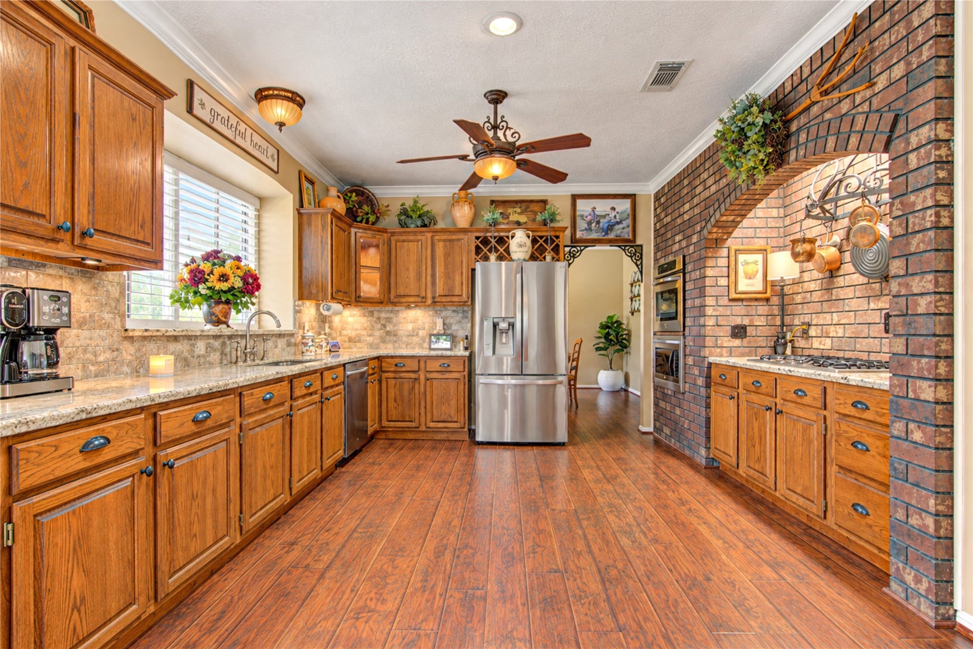 6839 Hertford Park Drive, Houston, TX 77084 Generous counter space and cabinet storage make this kitchen as practical as it is charming.