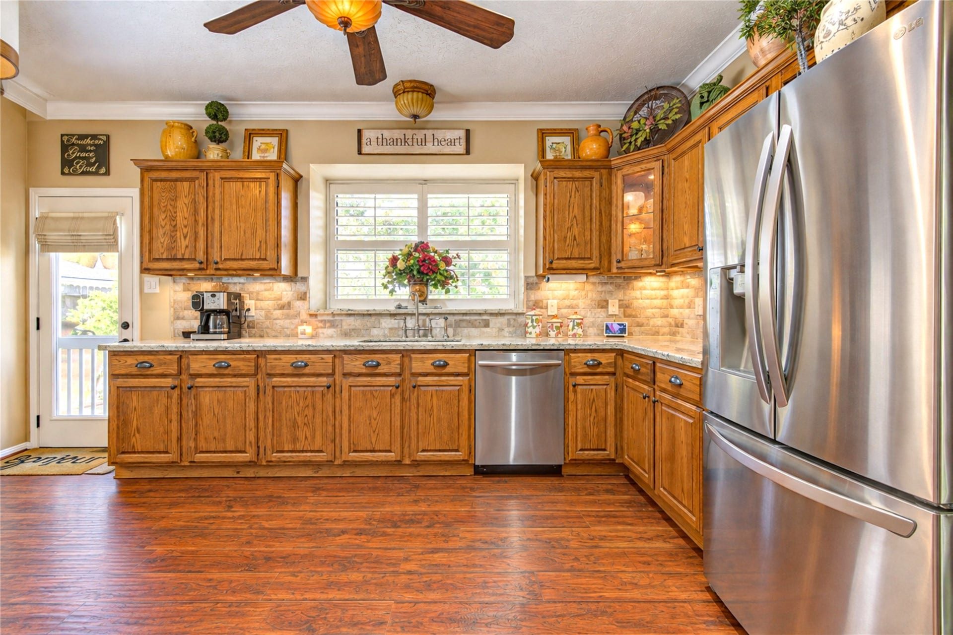 6839 Hertford Park Drive, Houston, TX 77084 A window above the sink, under-cabinet lighting and ample storage brighten everyday kitchen tasks.