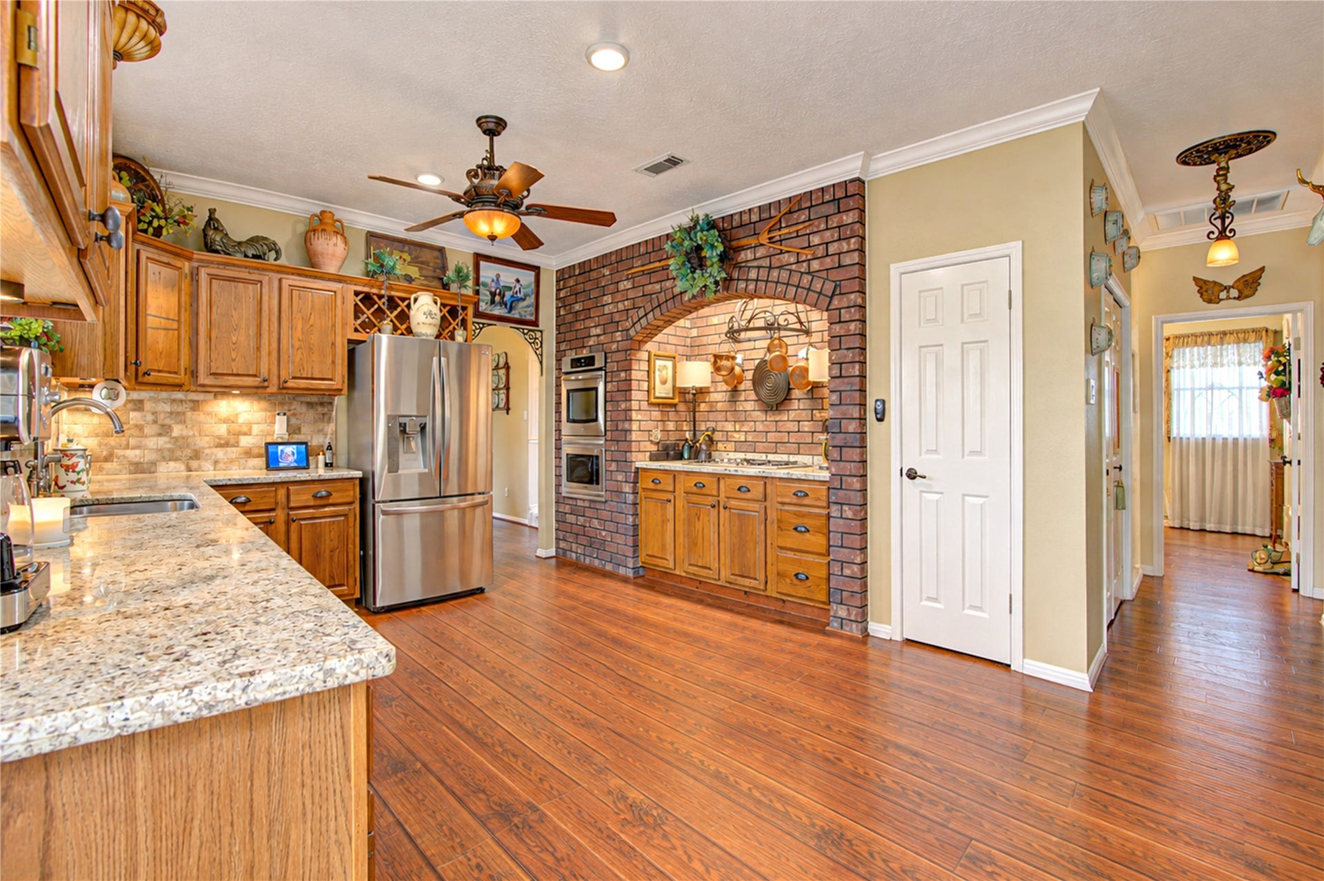 6839 Hertford Park Drive, Houston, TX 77084 An additional kitchen view highlights the generous layout and connection to the rest of the home.