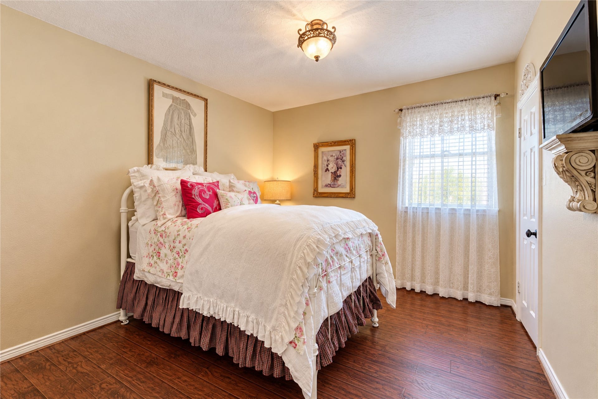 6839 Hertford Park Drive, Houston, TX 77084 An inviting secondary bedroom with natural light and carpet-free flooring.
