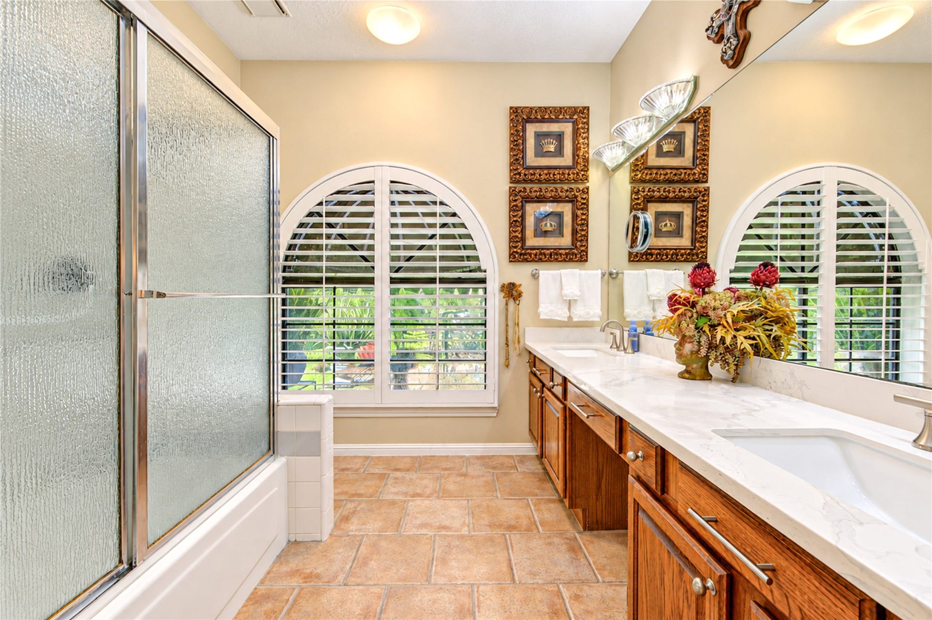 6839 Hertford Park Drive, Houston, TX 77084 A glass-enclosed shower, generous vanity storage and tile flooring complete the primary bath.