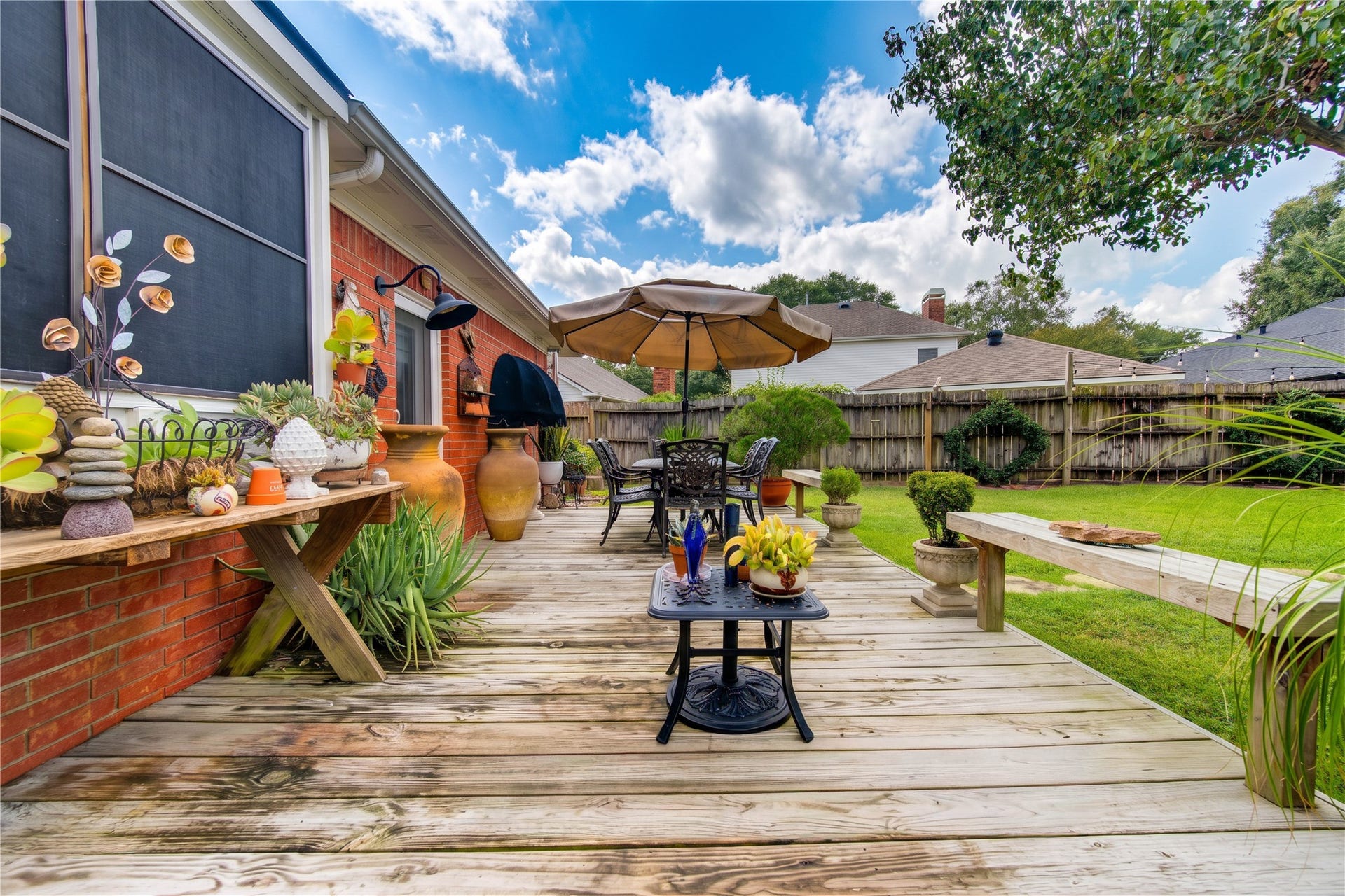 6839 Hertford Park Drive, Houston, TX 77084 Step outside to a backyard deck surrounded by thoughtfully maintained greenery.