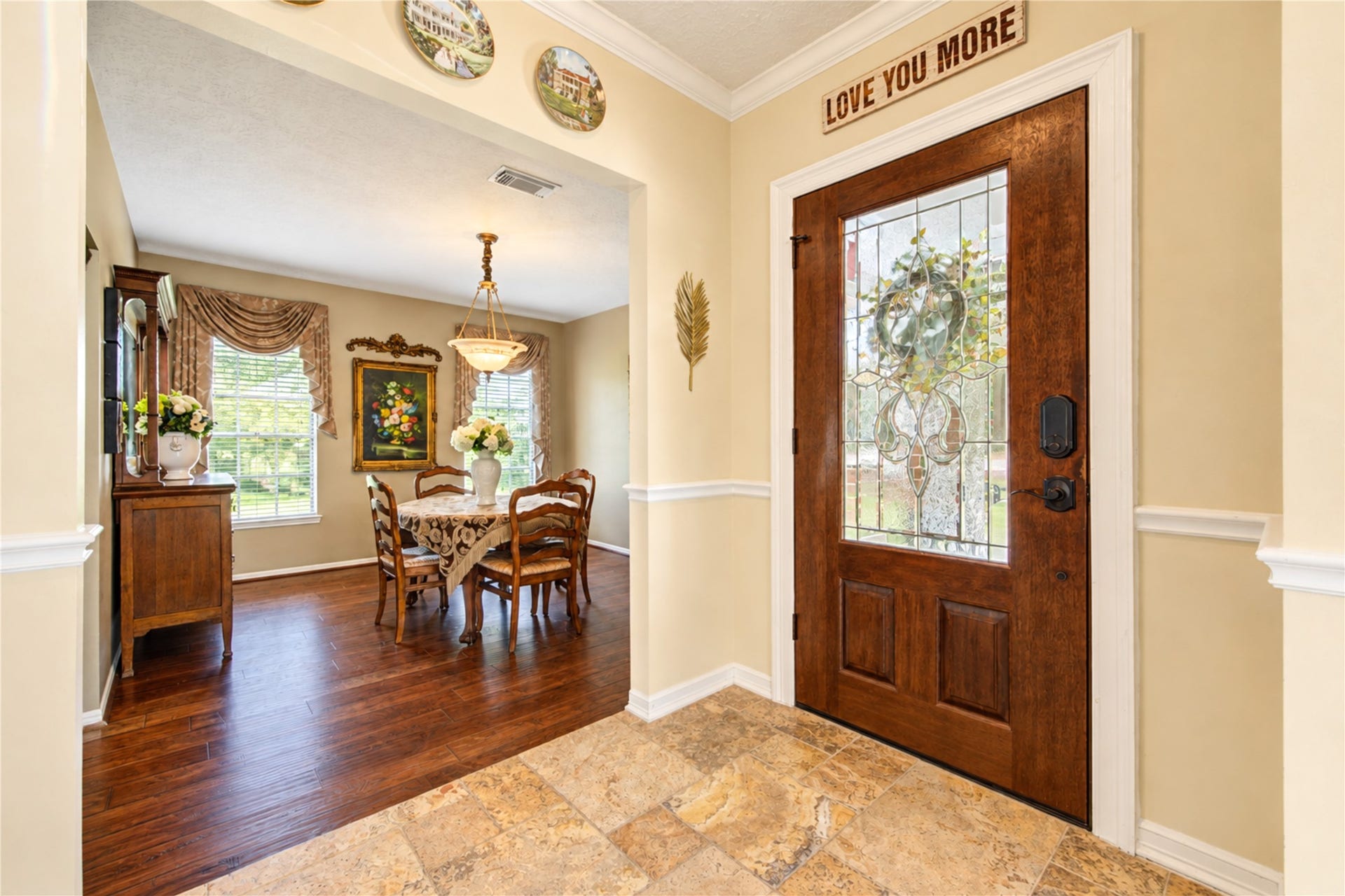 6839 Hertford Park Drive, Houston, TX 77084 A decorative glass front door welcomes you into the tiled entry, with the dining room just beyond.