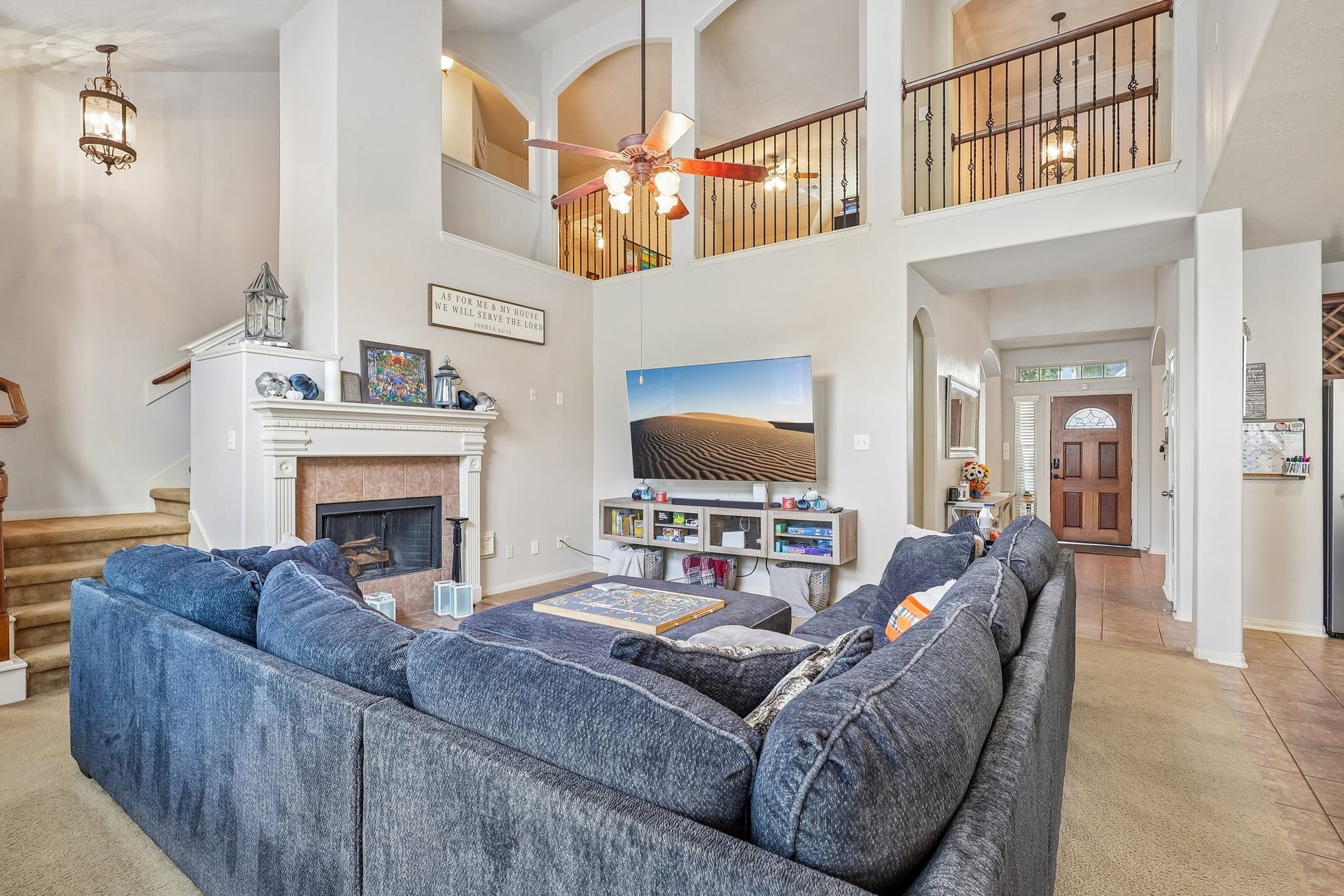 4731 Maple Creek Drive, Fresno, TX 77545 The two story family room, where the wall of windows does the talking