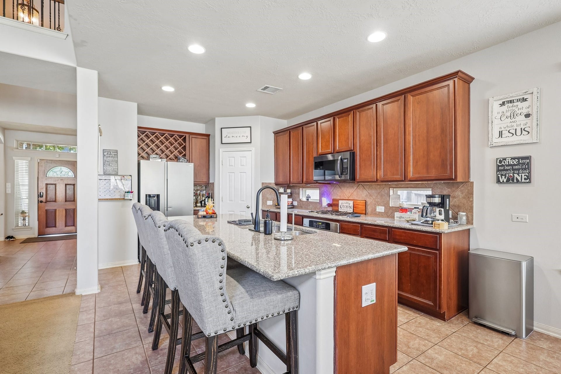 4731 Maple Creek Drive, Fresno, TX 77545 An island built for homework, happy hour, and everything in between