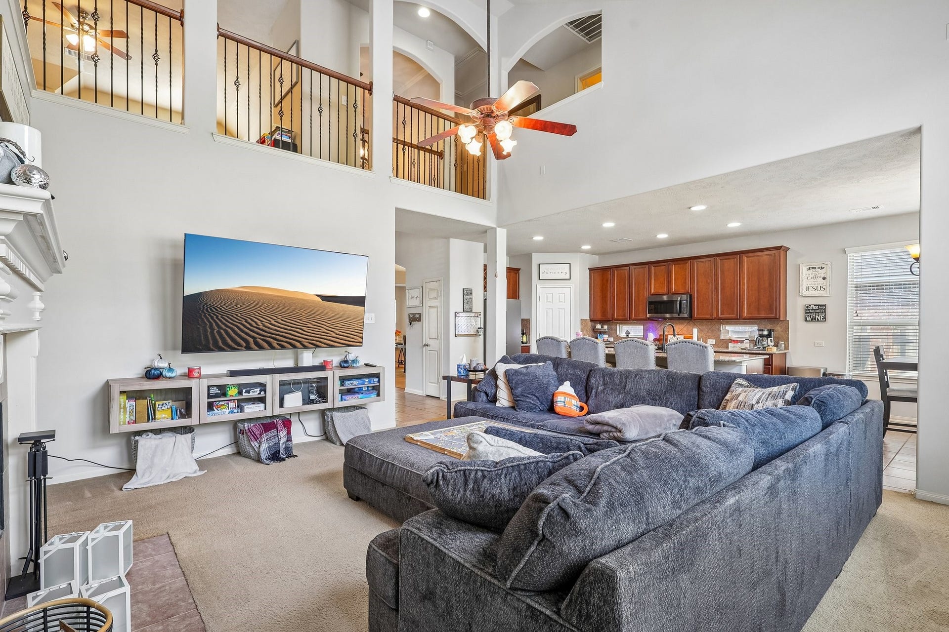 4731 Maple Creek Drive, Fresno, TX 77545 One open sweep from the sofa to the kitchen to the balcony above