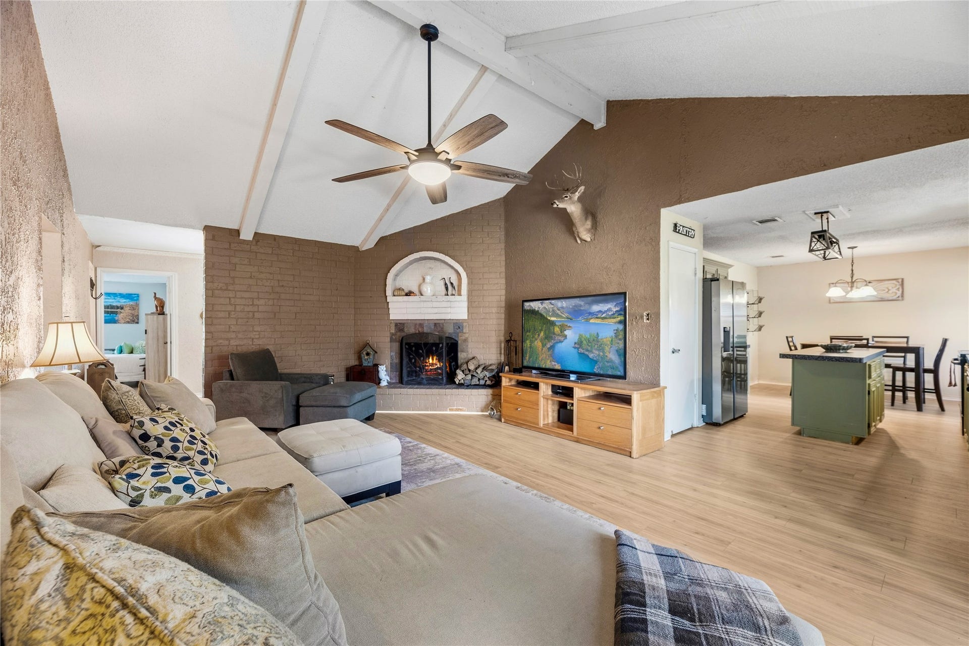 View from the living room toward the kitchen, showing the open connection between everyday gathering spaces.