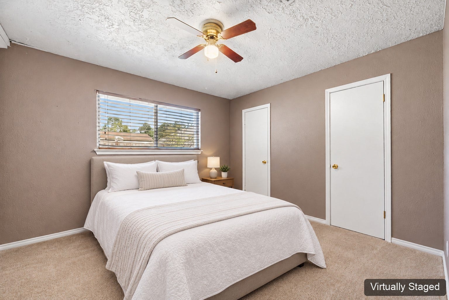 Virtually staged bedroom shown with a bed to illustrate a sleeping arrangement. The original photo at the end shows the room furnished as an office.