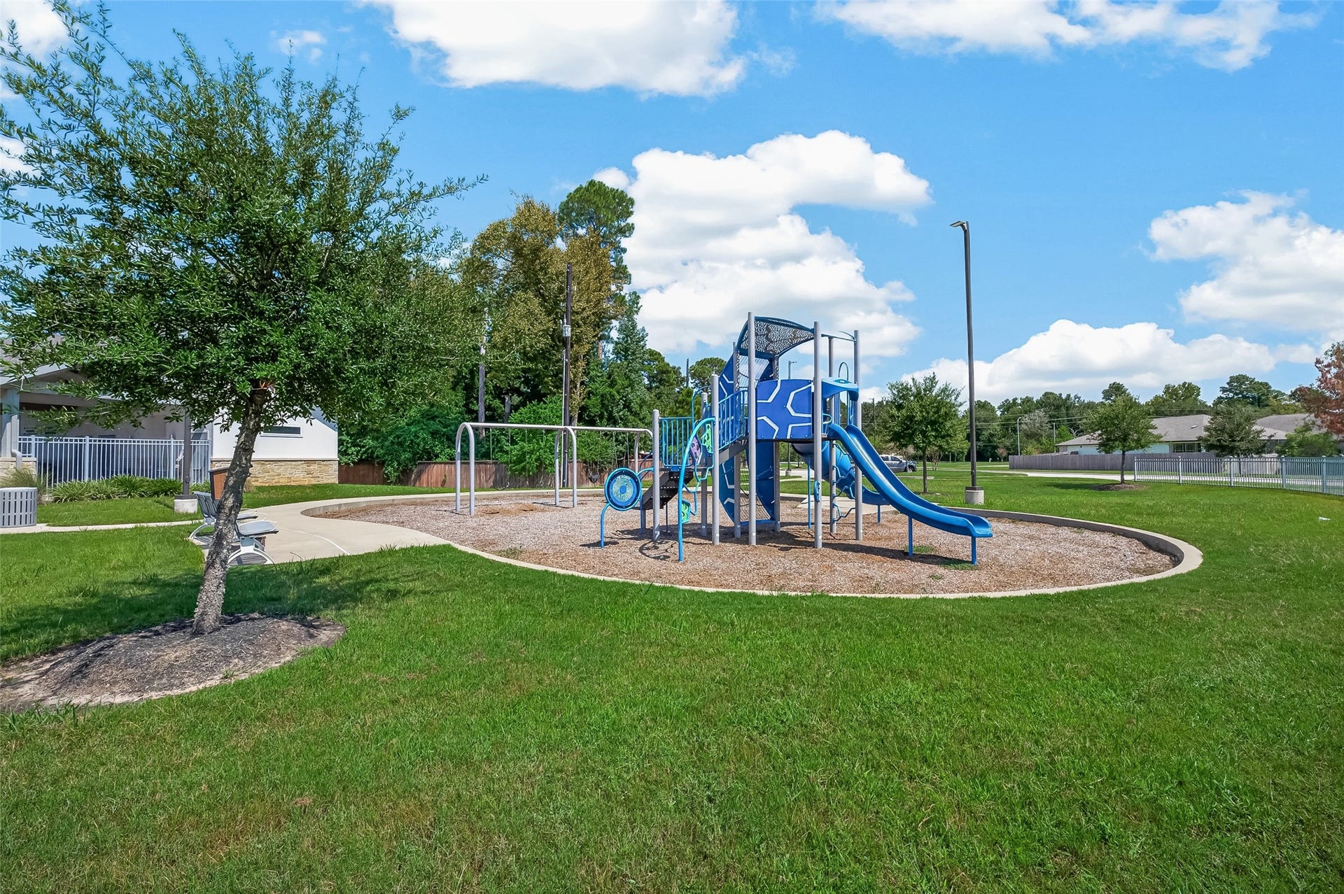 2321 W Winding Pines Drive, Tomball, TX 77375 A neighborhood playground is an amenity that is just a short walk away.