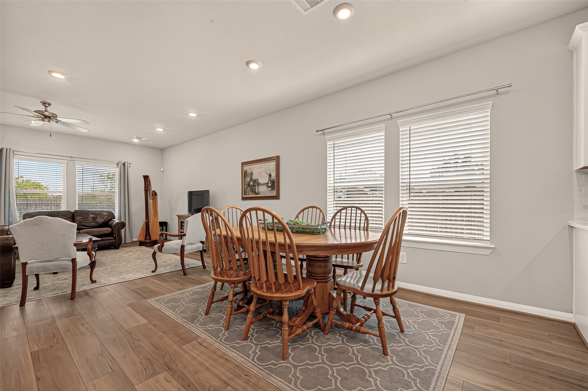 2321 W Winding Pines Drive, Tomball, TX 77375 The open floor plan moves from the kitchen to the dining area and into the family room.