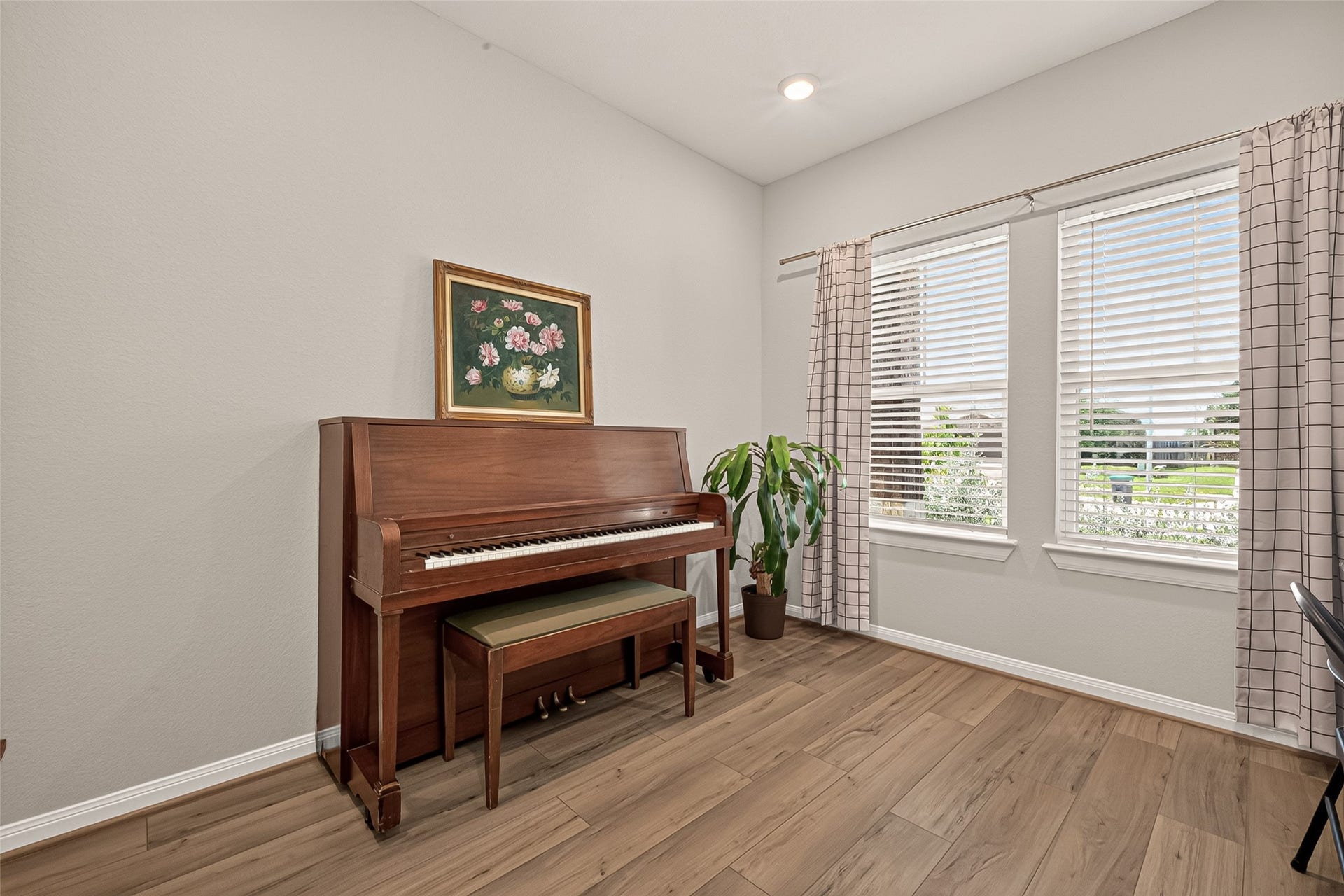 2321 W Winding Pines Drive, Tomball, TX 77375 This office/home study is set at the front of the house and gives a beautiful view of the front yard.