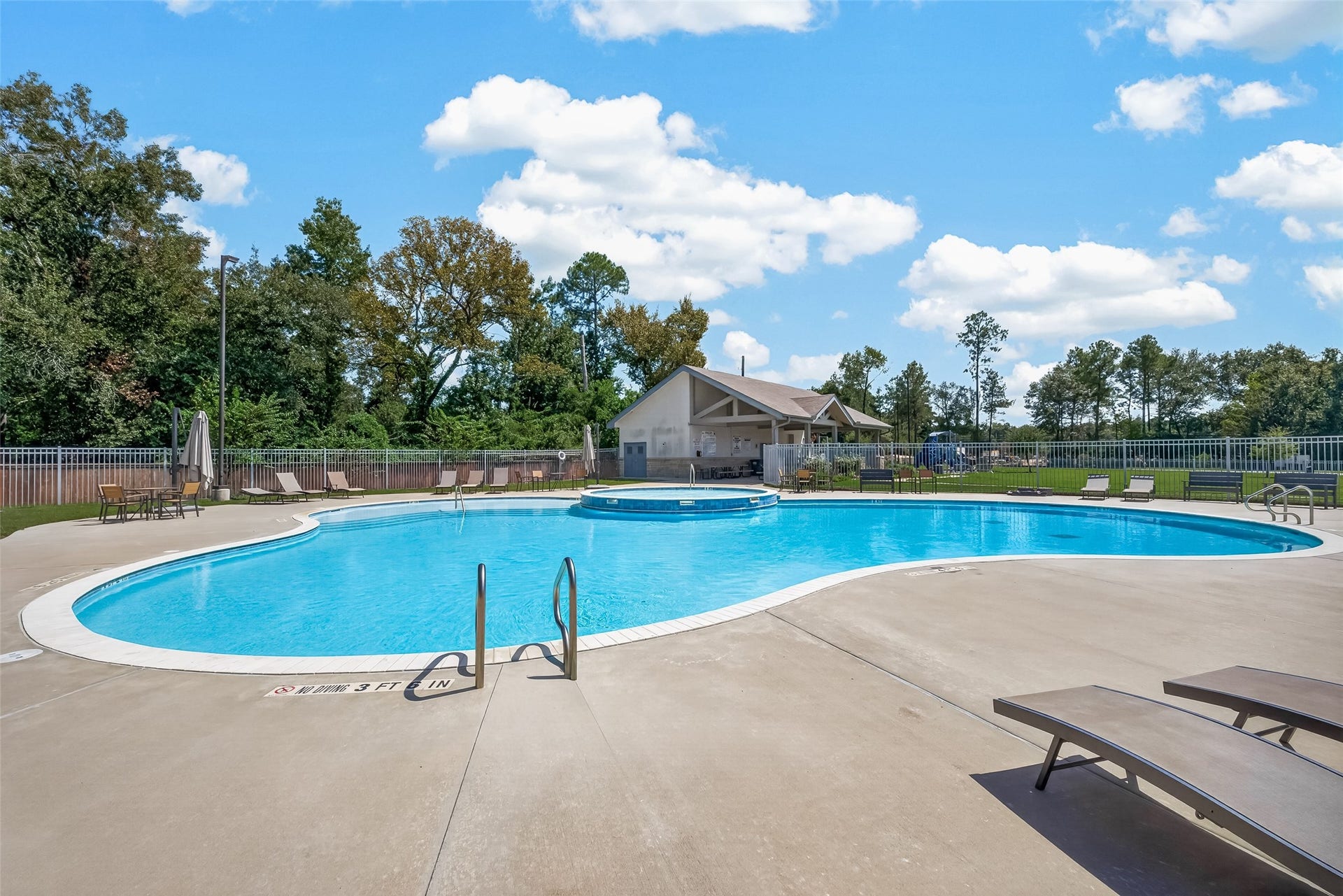 2321 W Winding Pines Drive, Tomball, TX 77375 Enjoy swimming in the neighborhood pool on our hot Texas days.